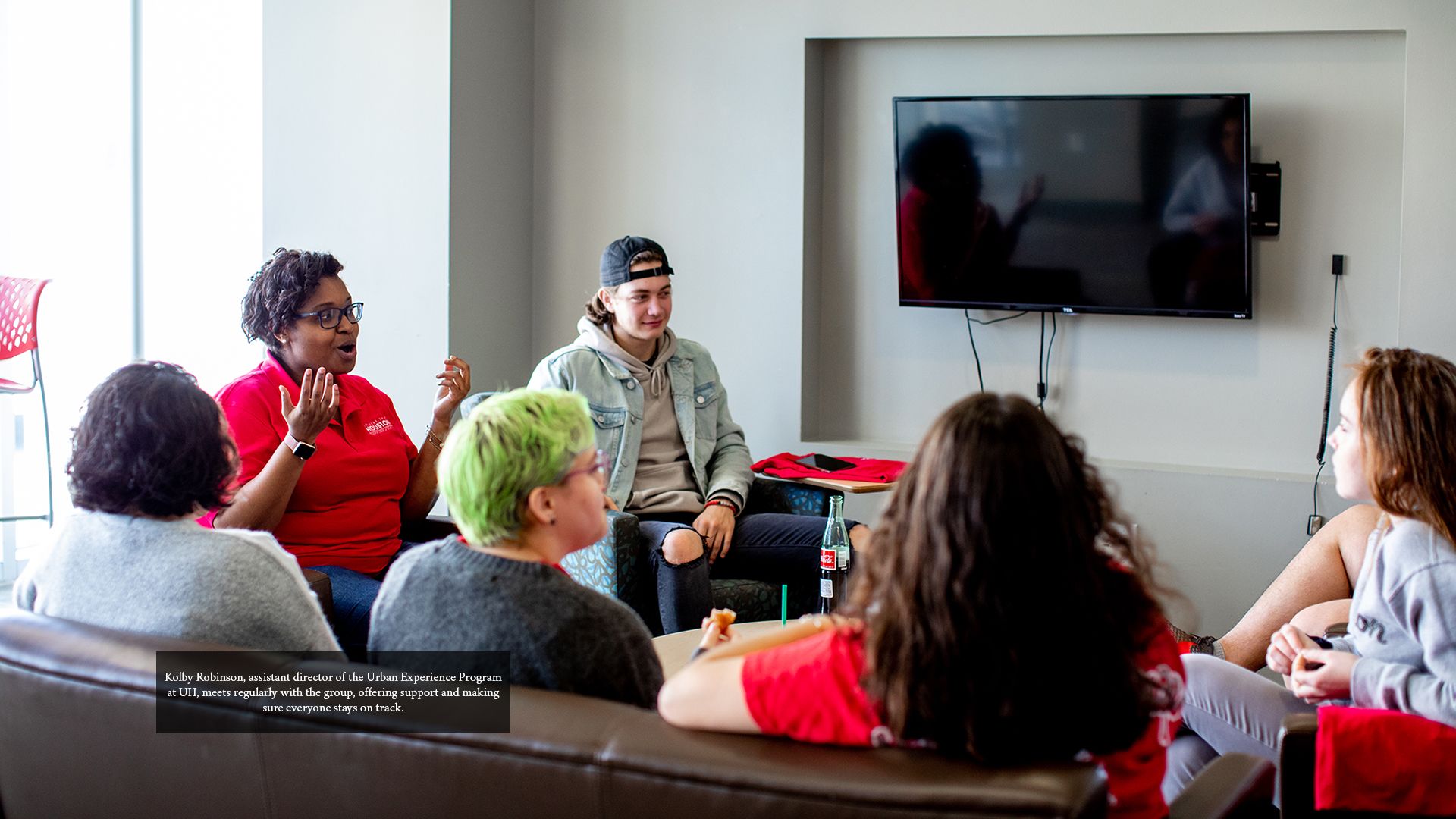 Kolby Robinson, assistant director of the Urban Experience Program at UH, meets regularly with the group, offering support and making sure everyone stays on track.