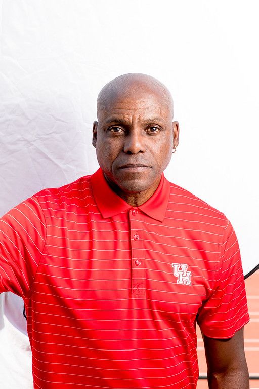 Carl Lewis in red shirt
