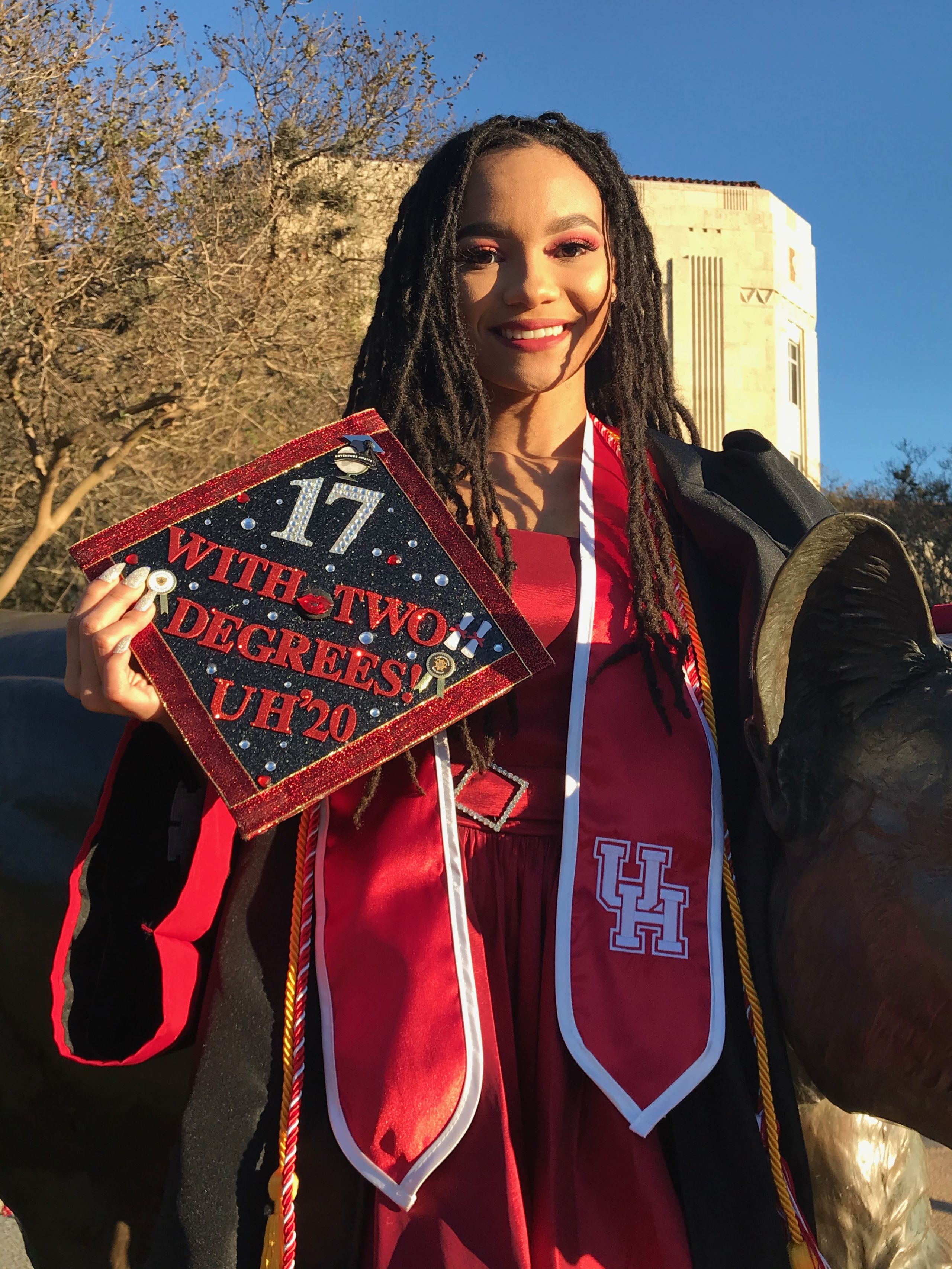 Salenah Cartier holding her graduation cap