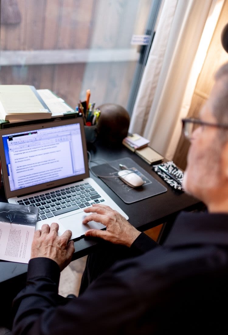 Tejada typing on his computer