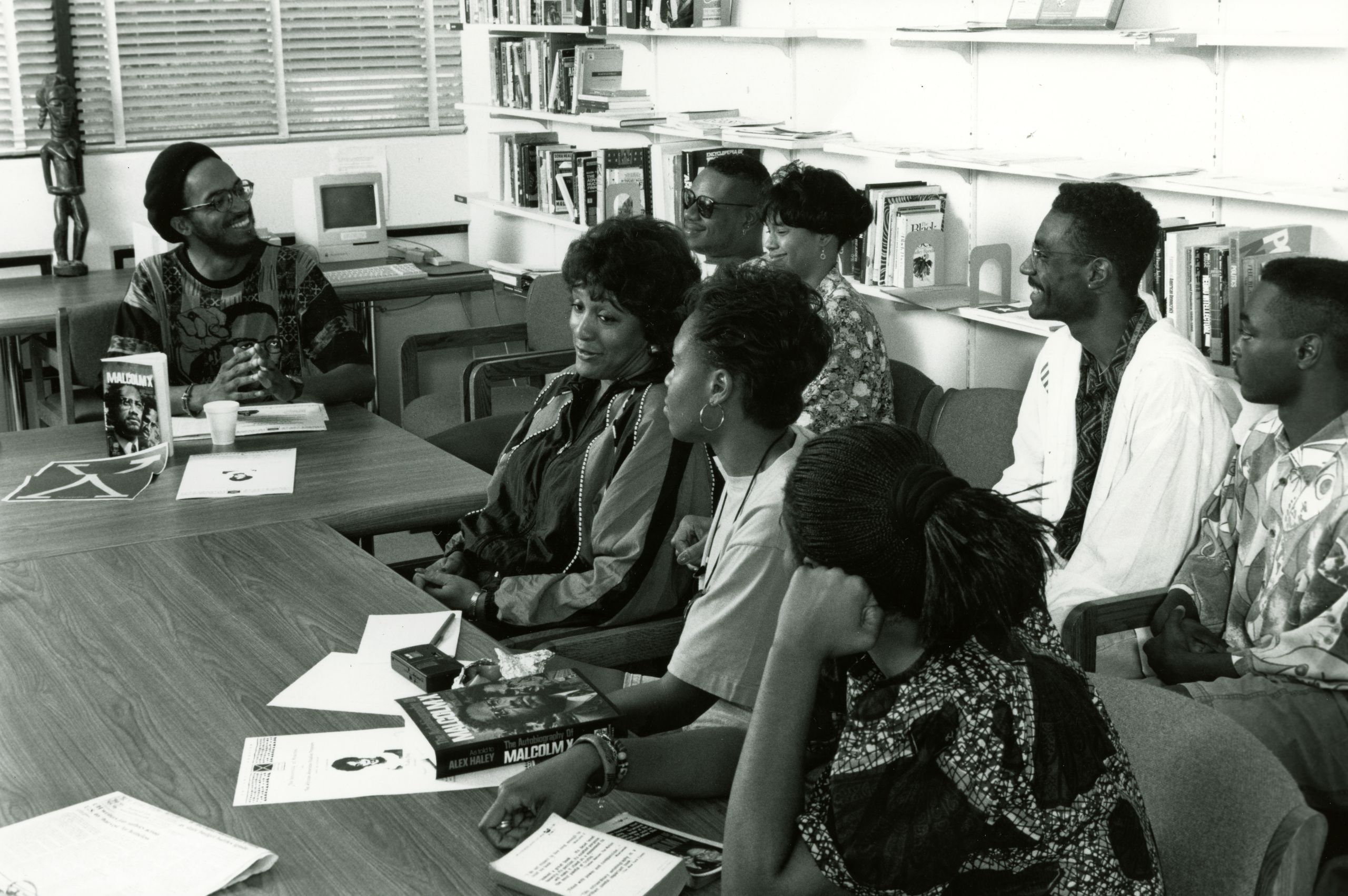 Students at table discussing book