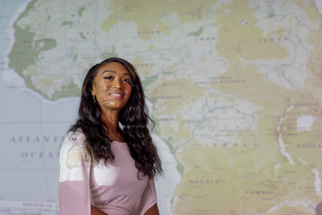 Student in front of map of Africa