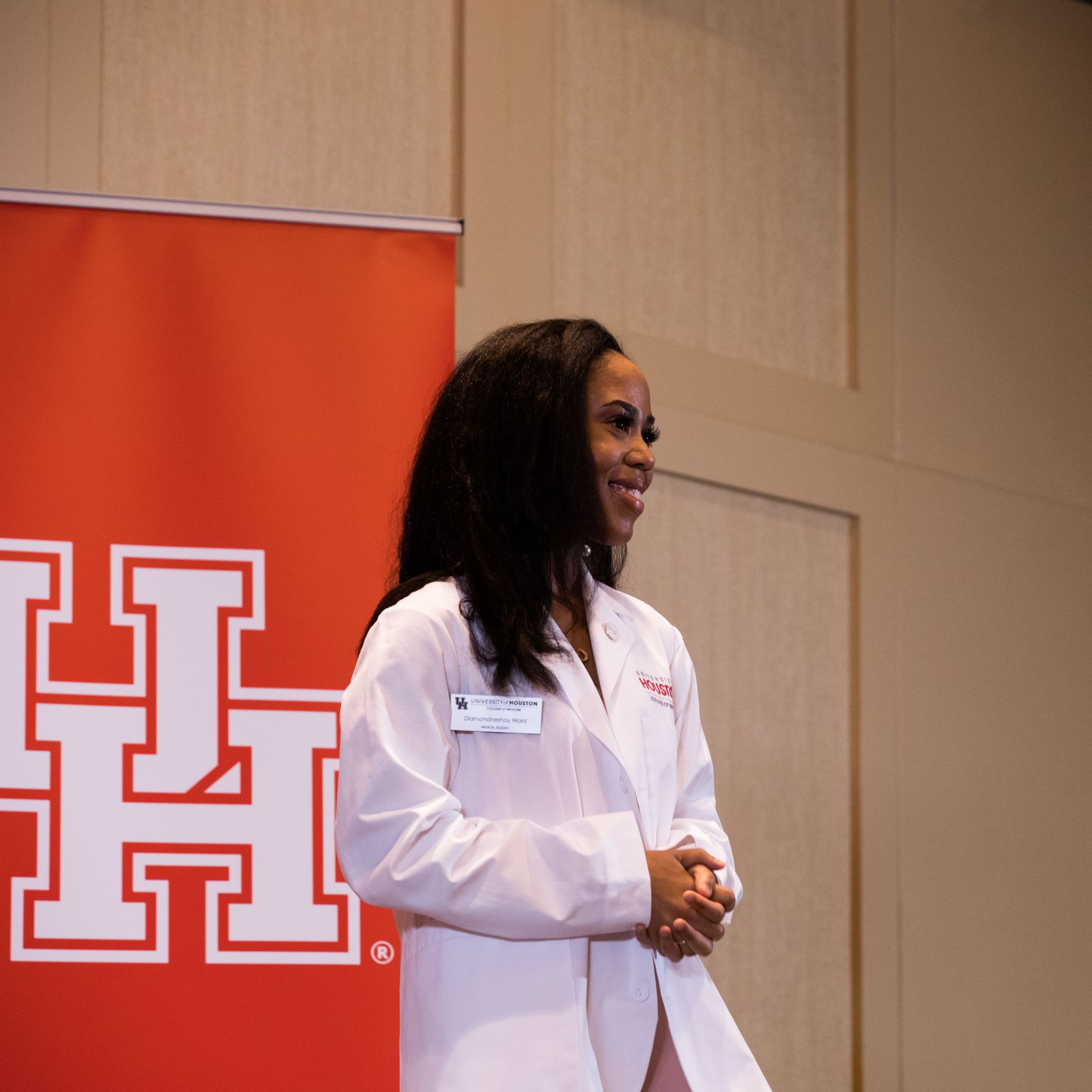 Photo of medical student Diamondneshay Ward in her first white coat.