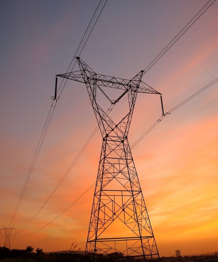 Electric lines with sunset in the background