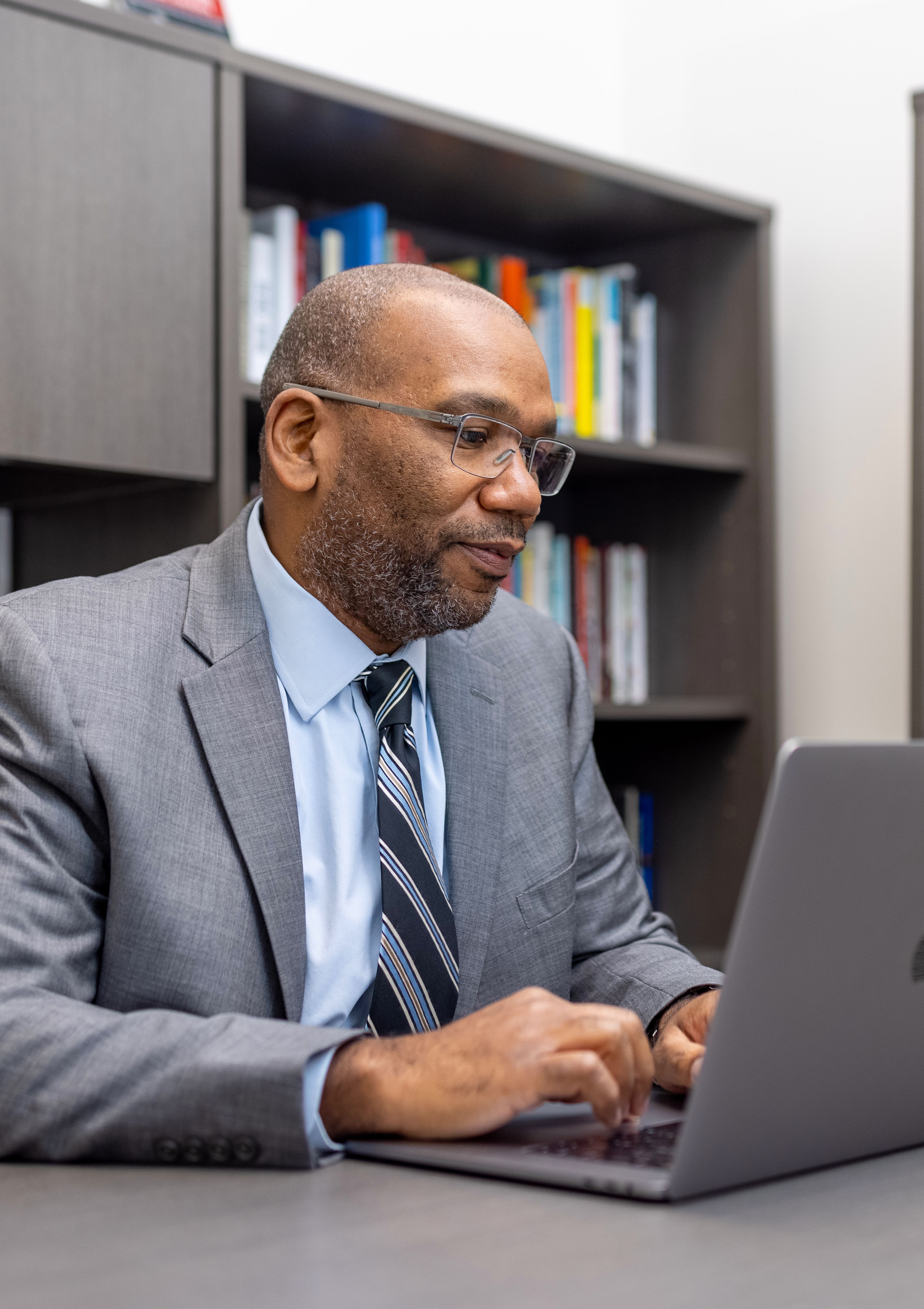 Cedric Tolliver works on his computer.