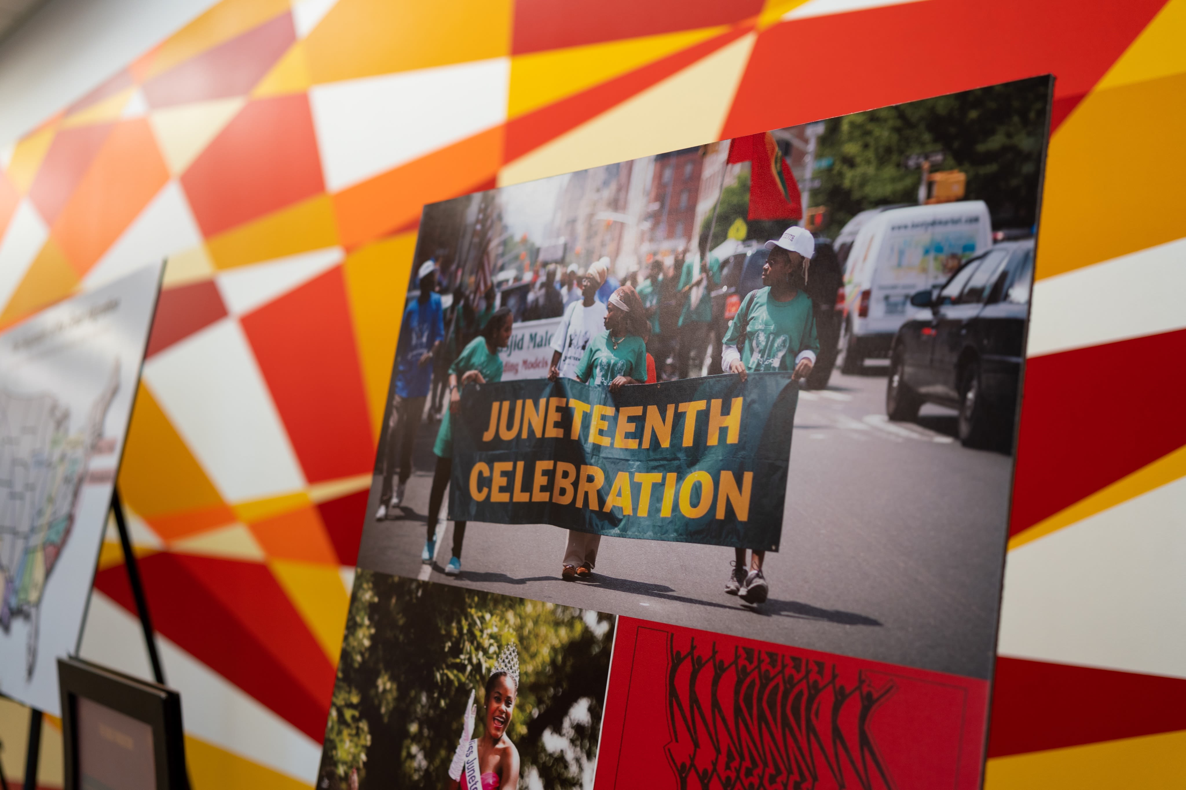 photo on display of marchers carrying "Juneteenth Celebration" sign
