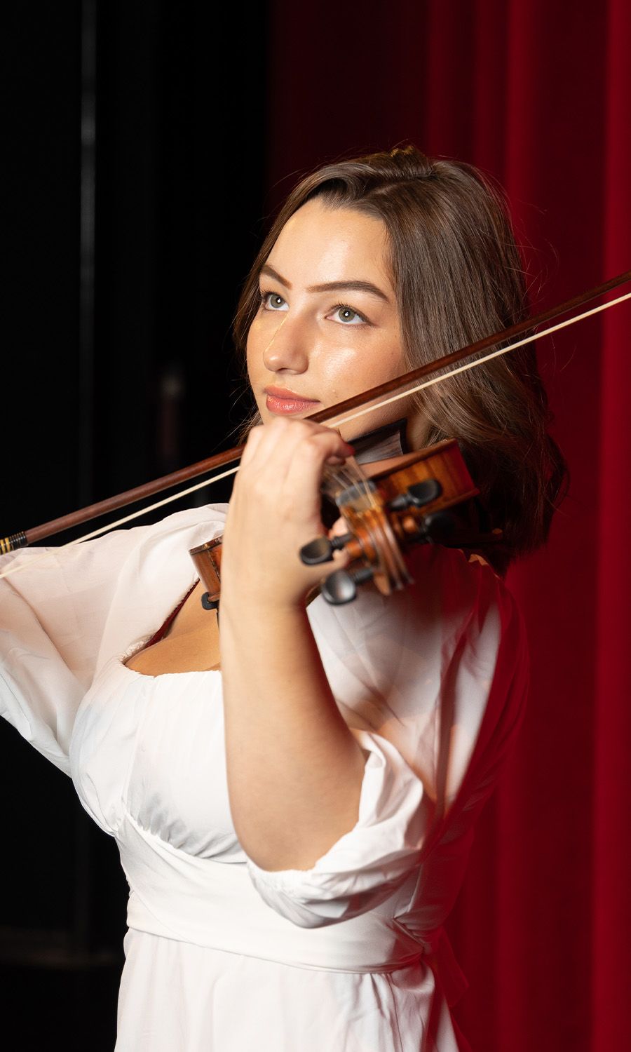 Miranda playing the violin