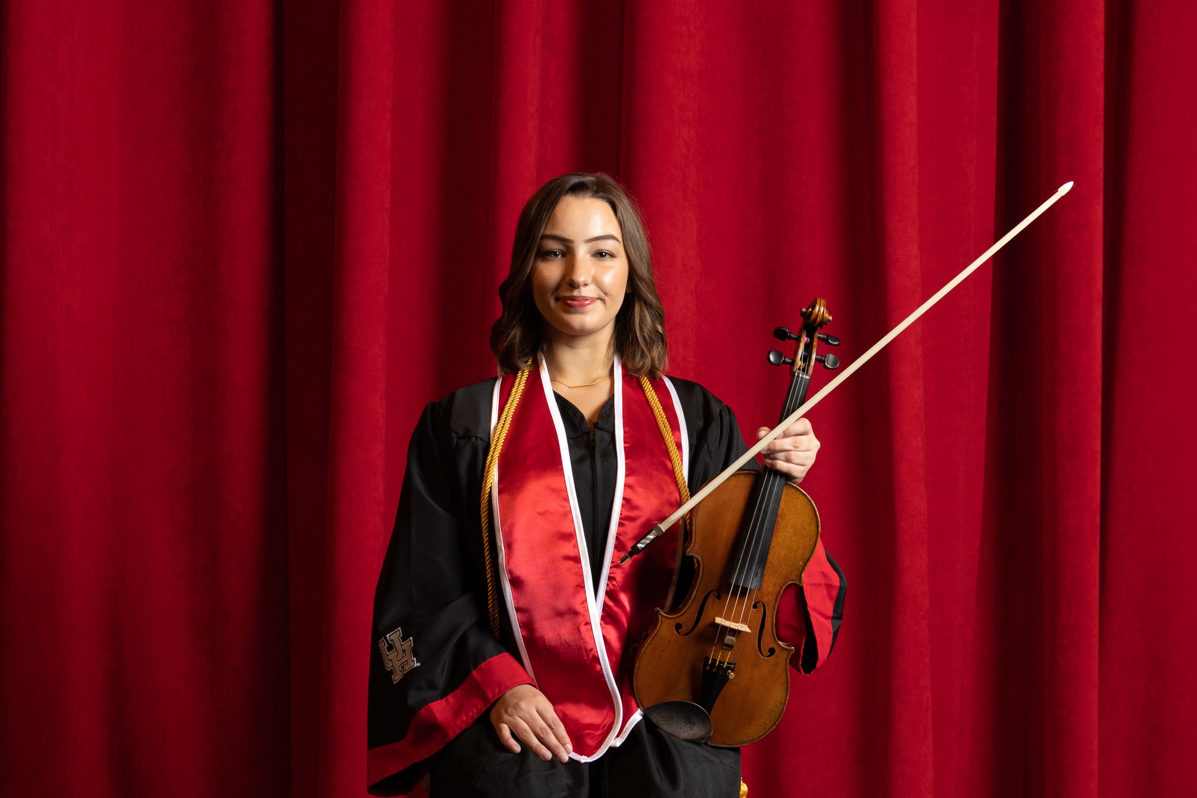 A picture of Miranda in her gown with her violin