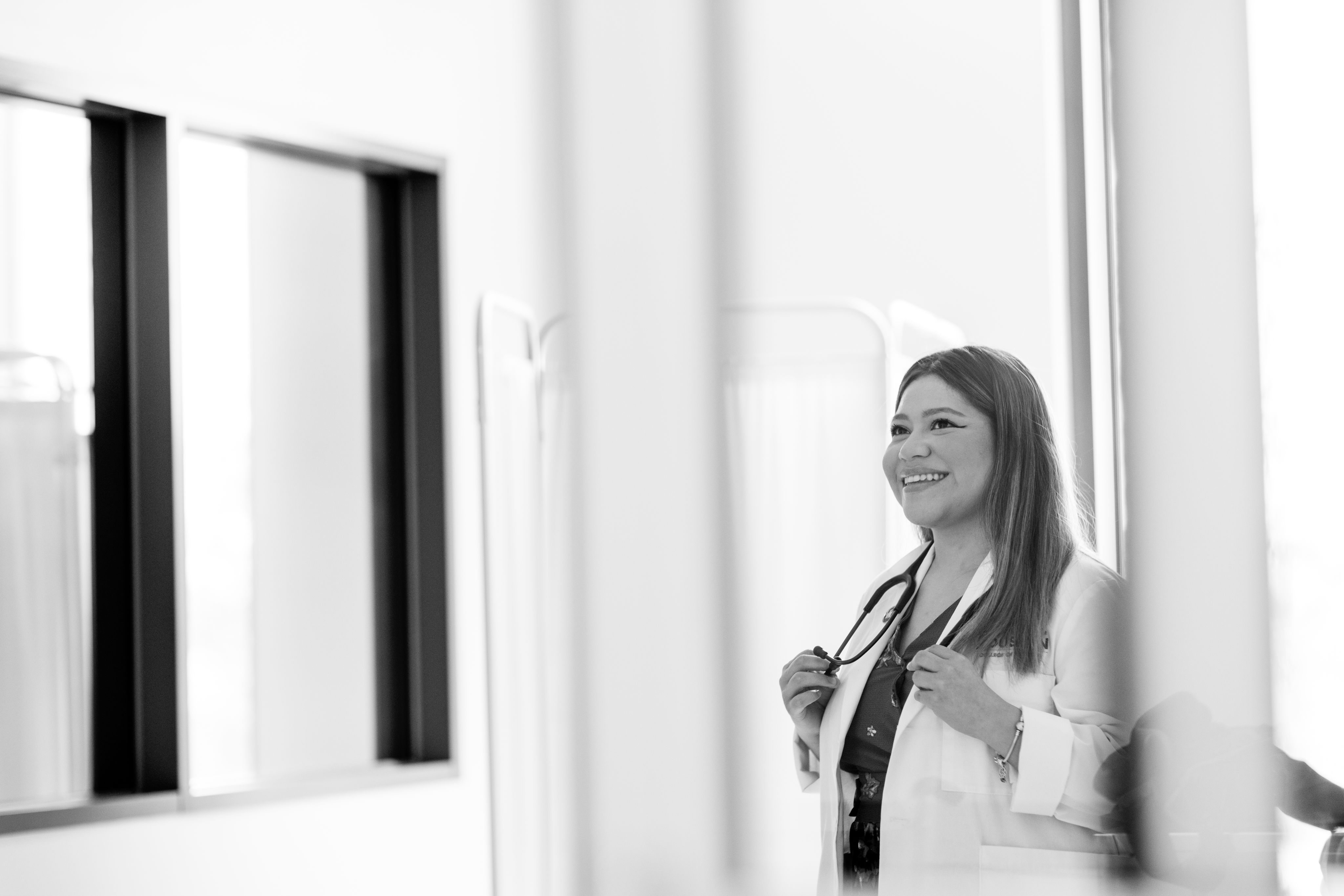 Student in white coat with stethoscope