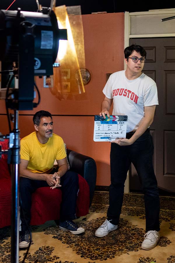 Actor and student on set.