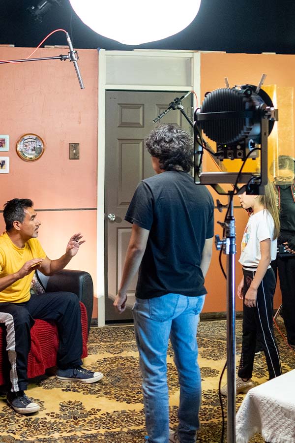 actors and students on set
