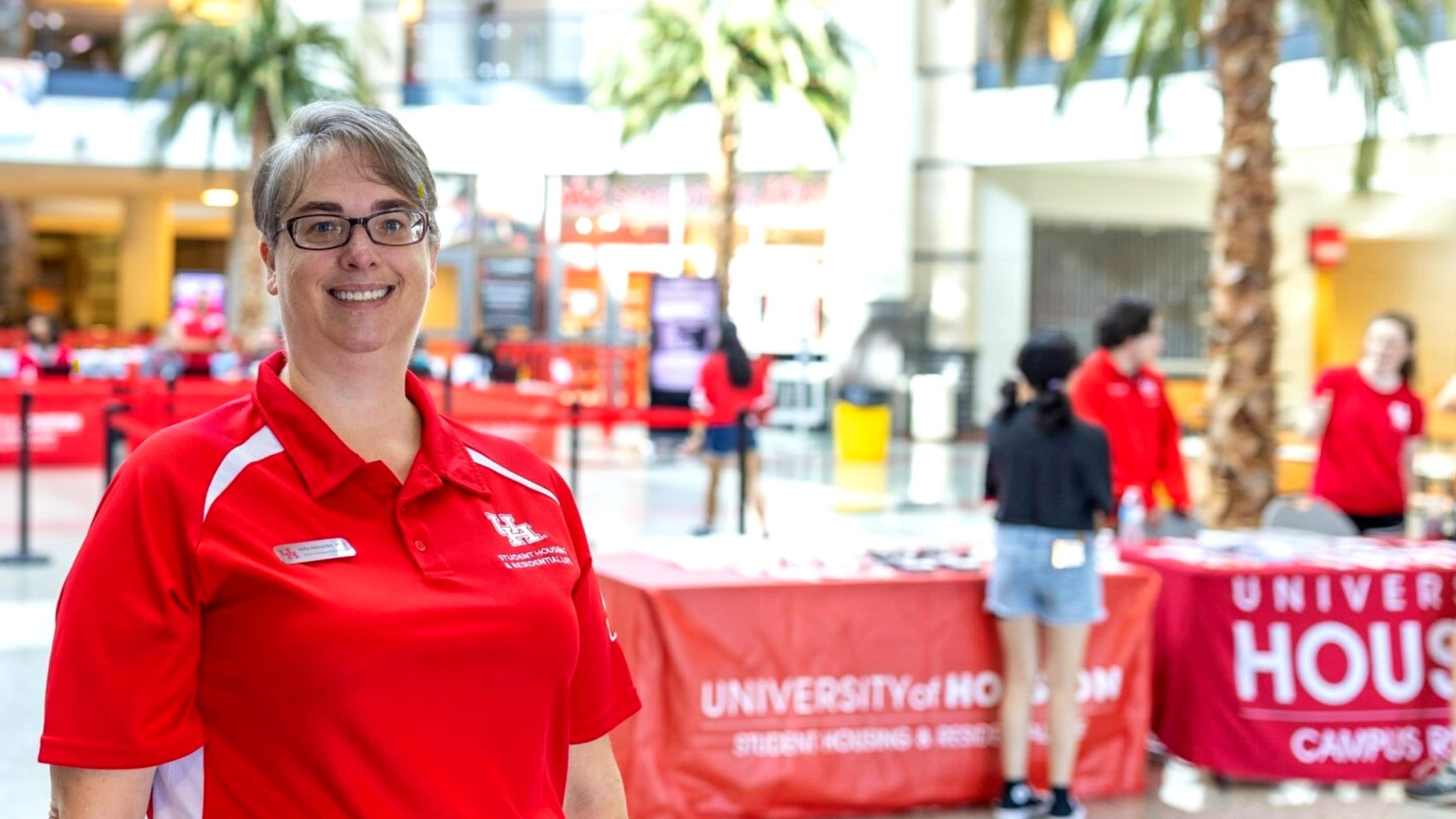 Portrait of Holly Alexander, Ph.D., standing in Campus Rec Center Rotunda
