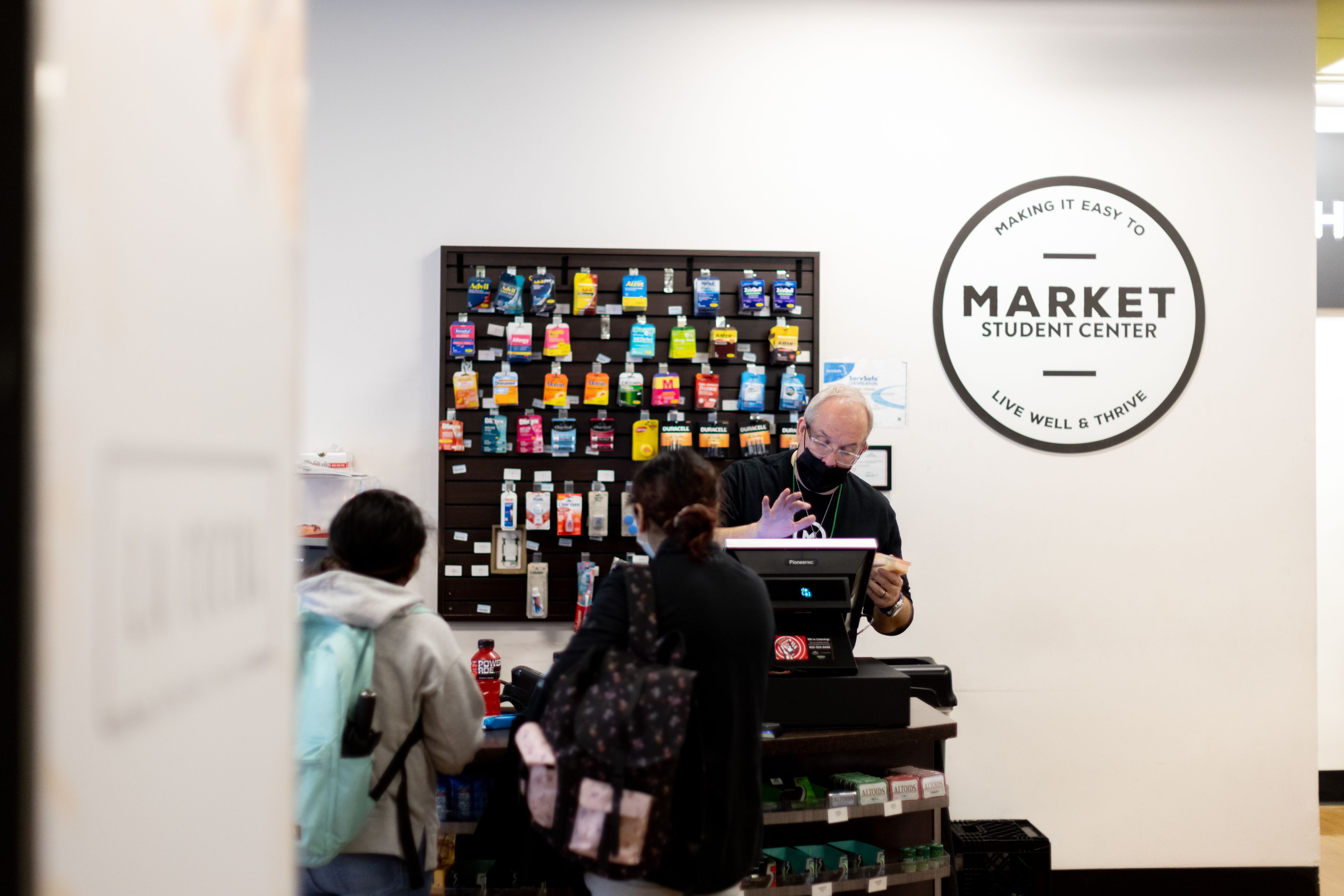 Richard Stidham rings up students in the Market Center store