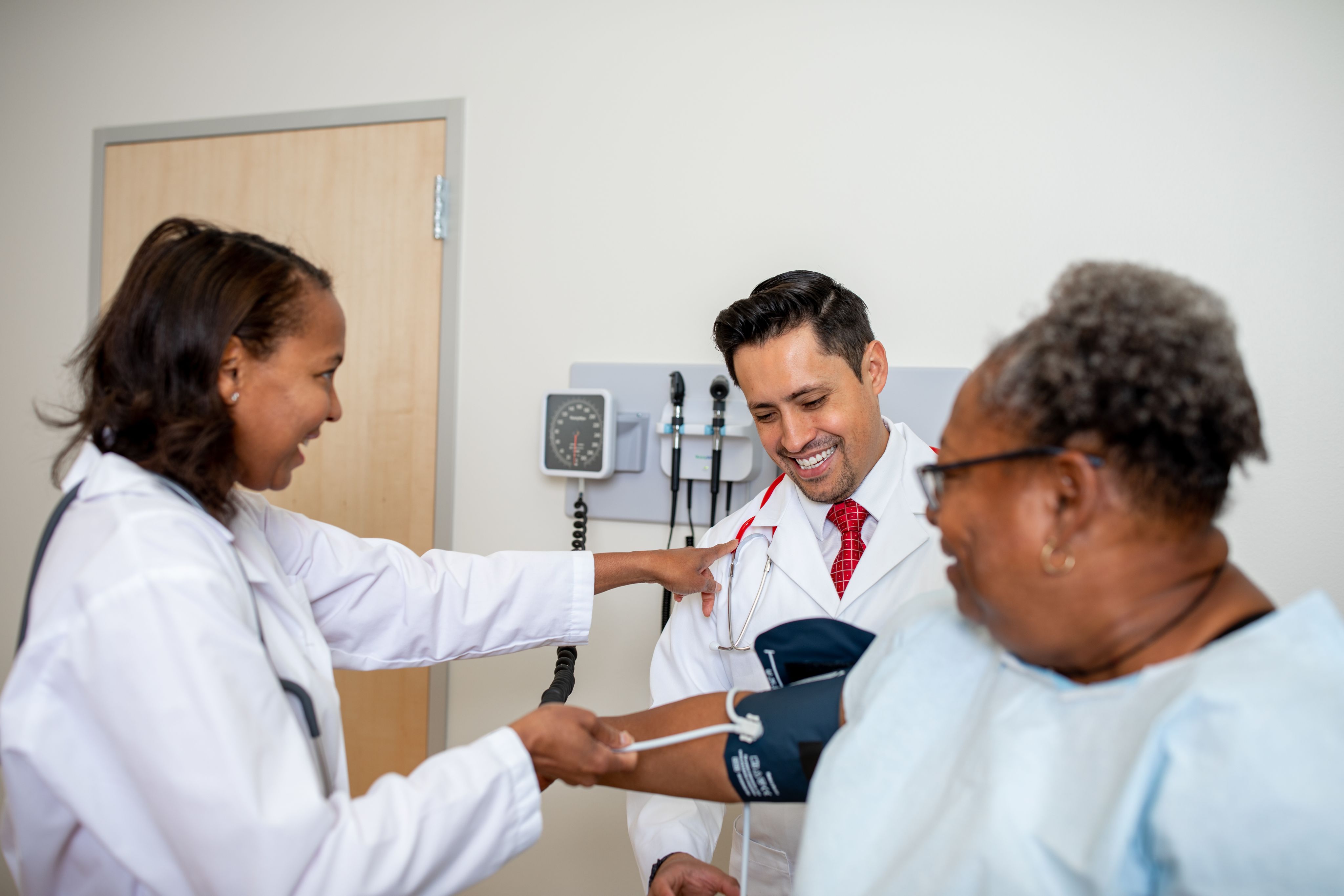 doctors visit with a patient in an exam room
