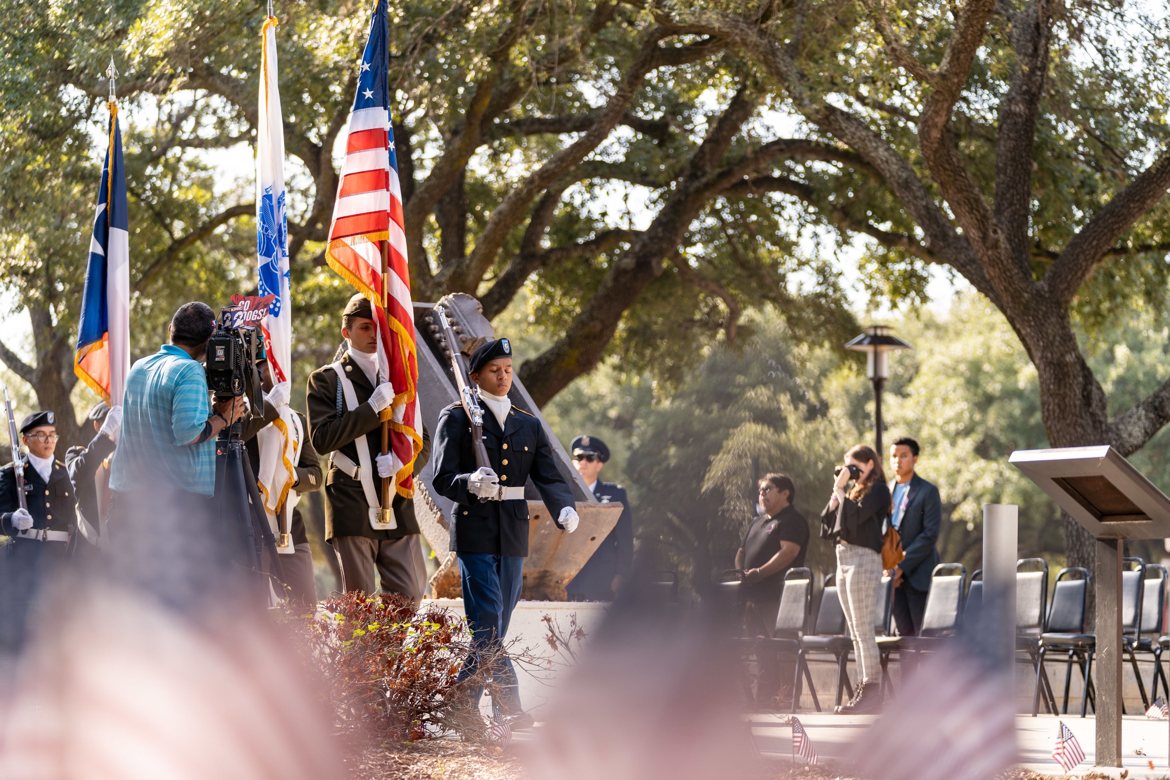 Army color guard presents the flags at a ceremony near 9/11 memorial on UH campus.