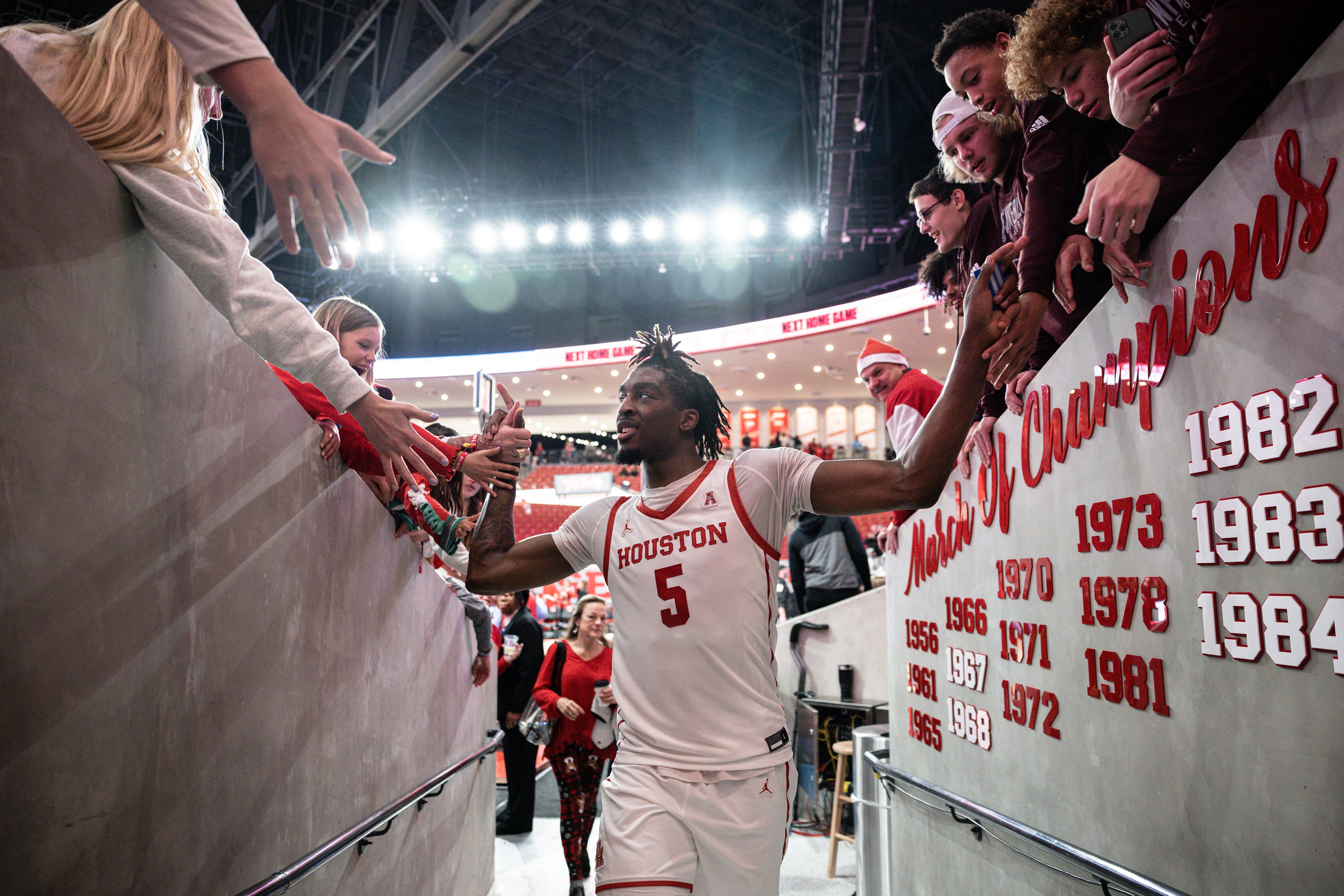 Ja'Vier Francis high fives fans walking back into the tunnel at the end of the game.