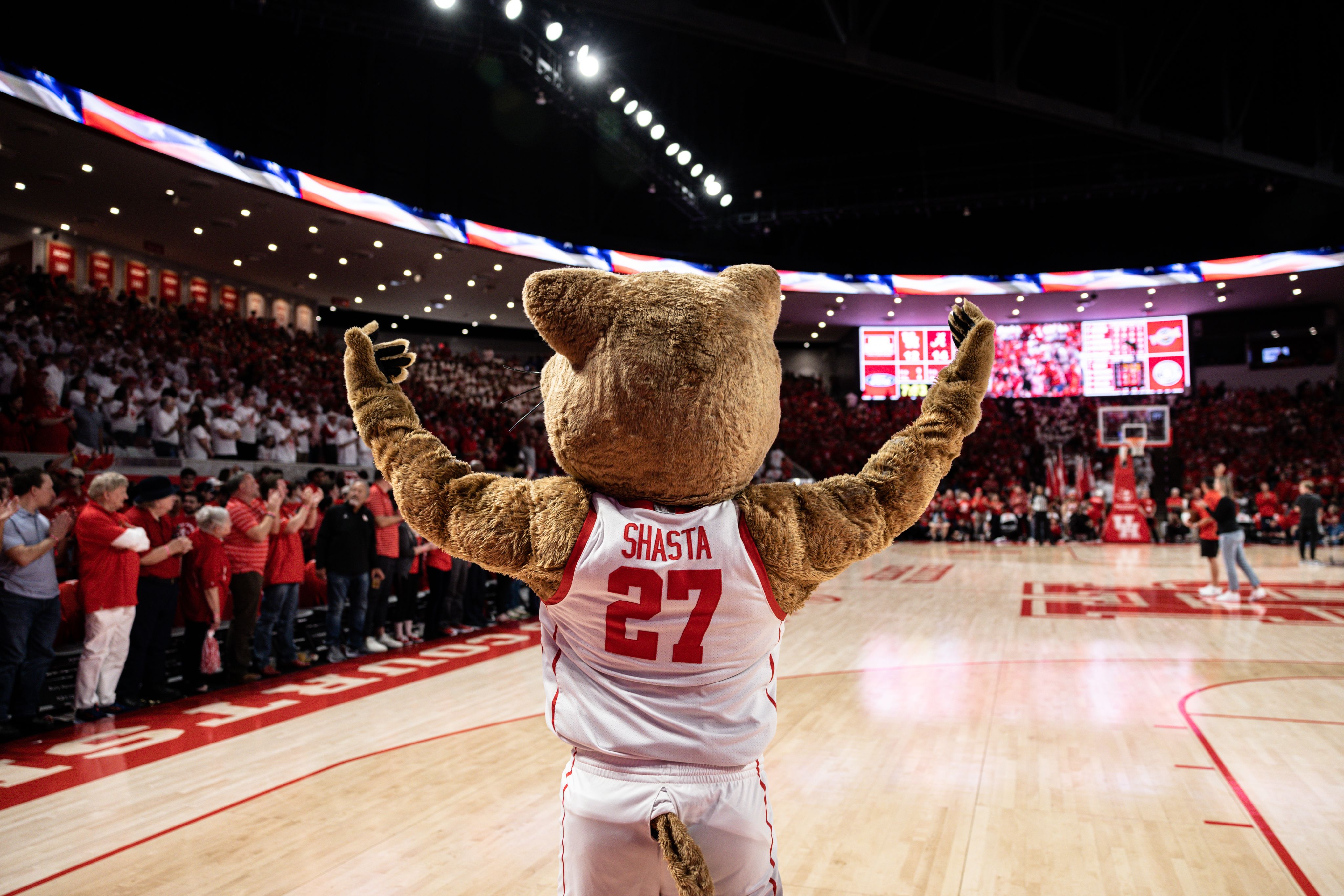 UH Mascot Shasta raising his hands to pump up the crowd.