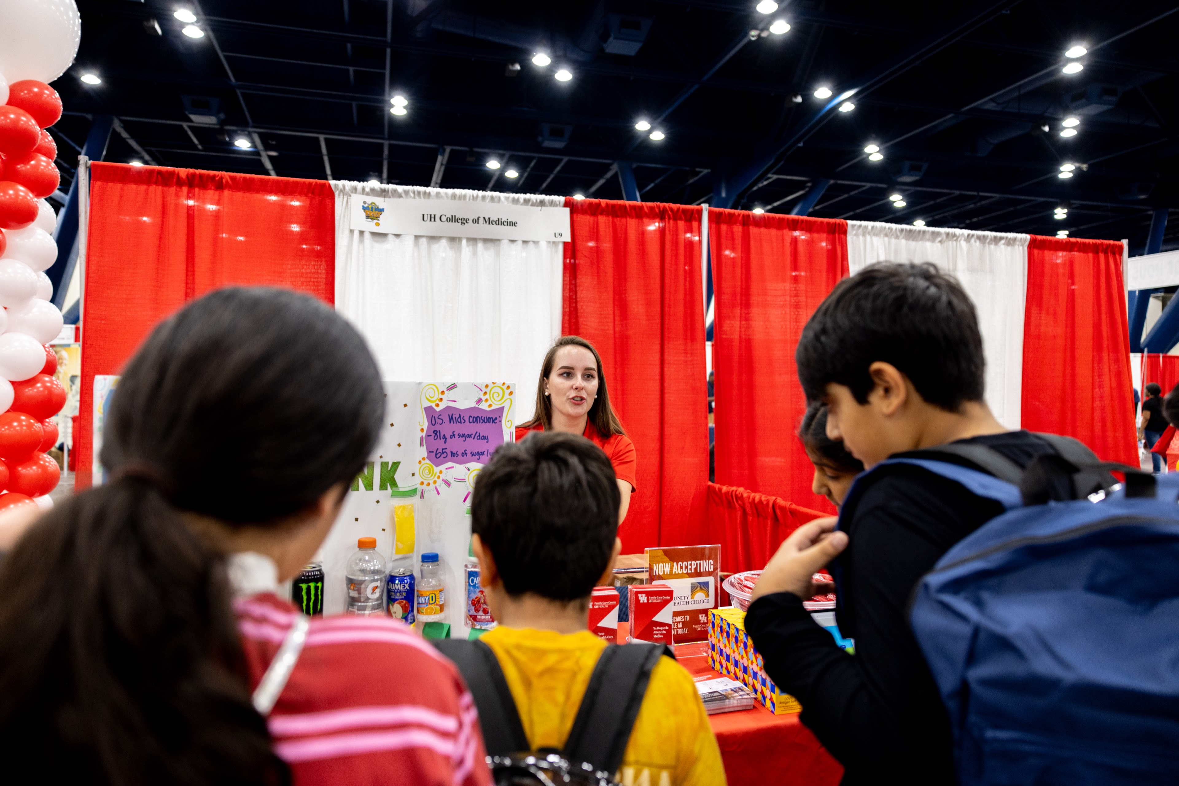 Rebecca Negri, marketing and outreach coordinator for the UH Health Family Care Center, speaks with kids about the importance of nutrition.