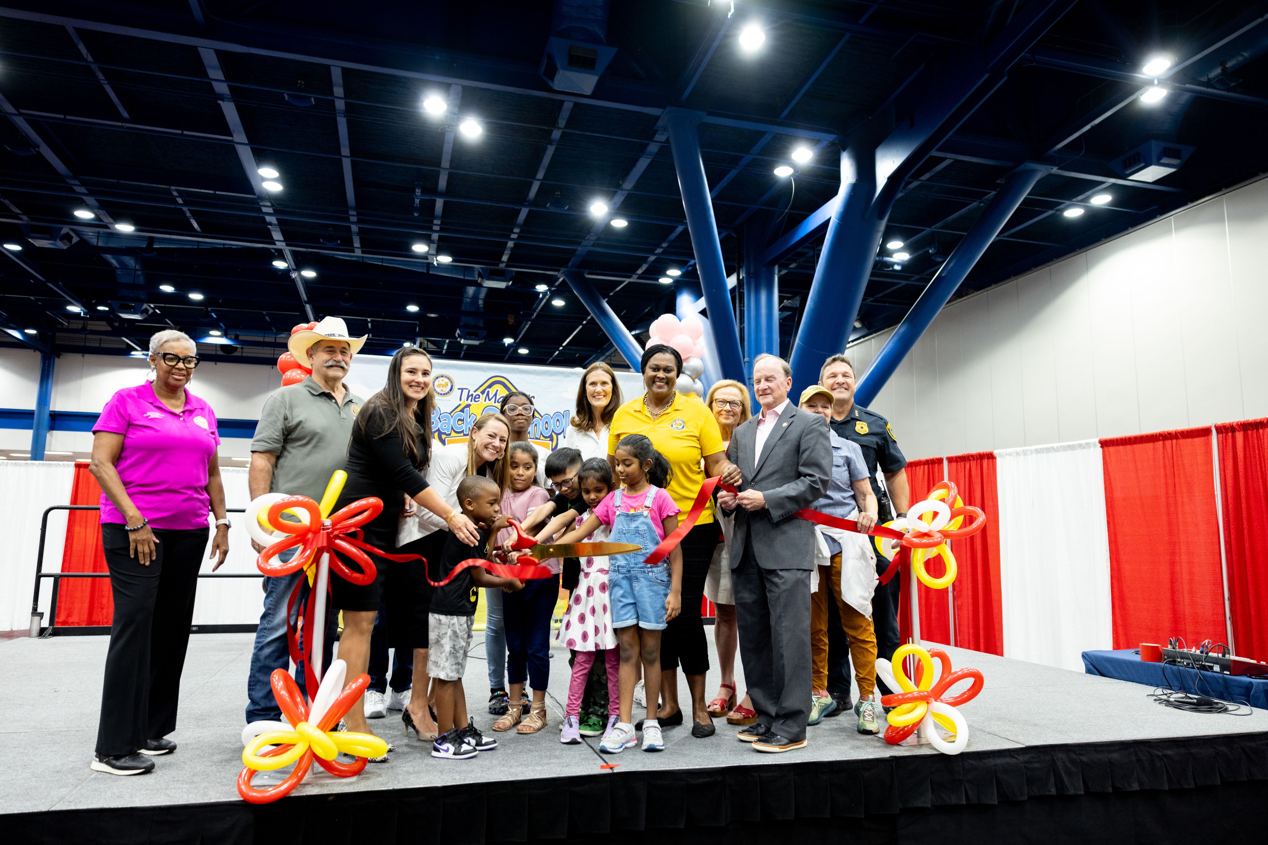 Diane V. Chase, UH Senior VP for Academic Affairs and Provost, joins dignitaries from the city of Houston and Shell Energy to cut the ribbon for the Mayor's Back to School Fest.