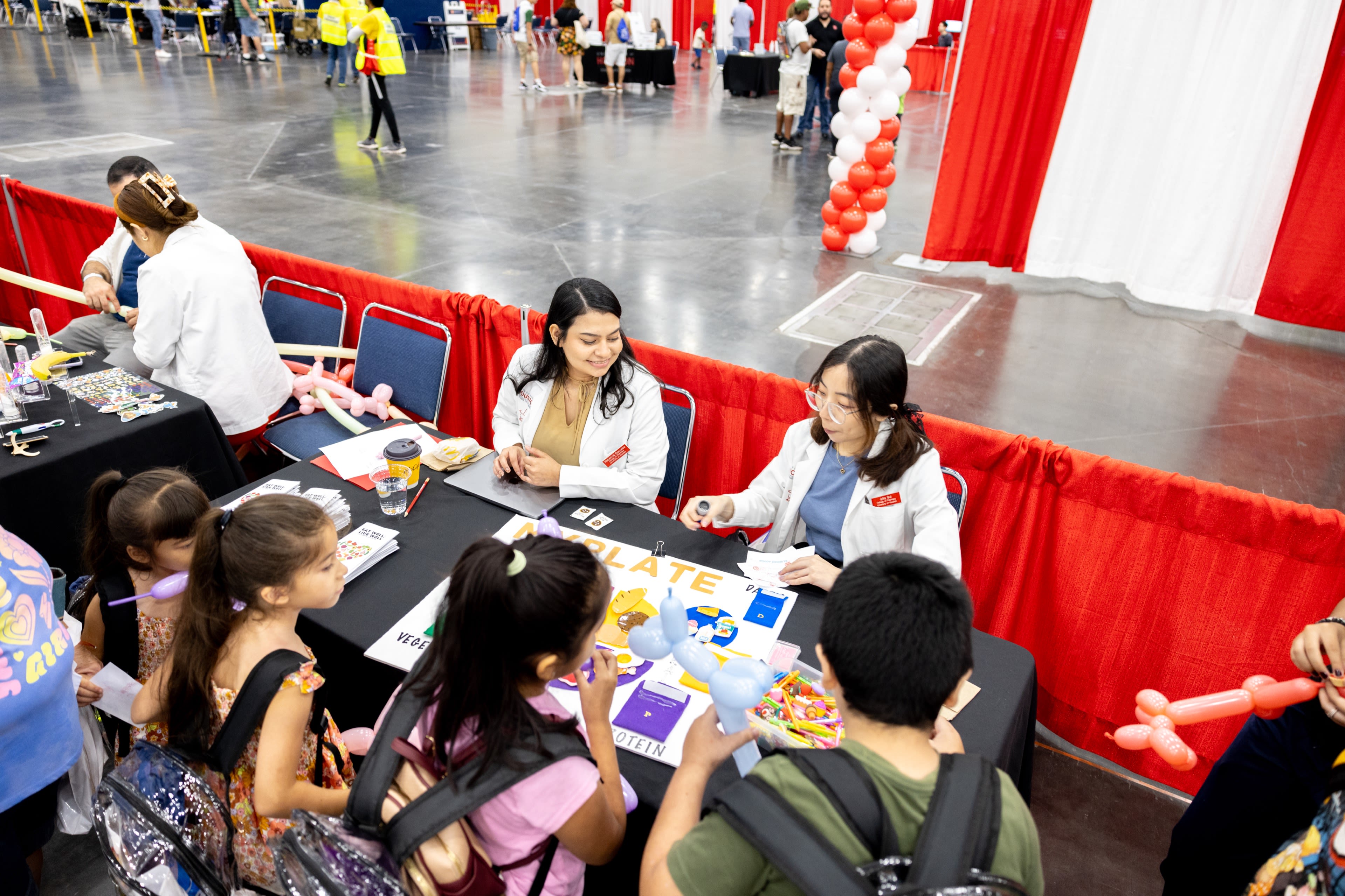 Student volunteers from the College of Pharmacy set up several stations with education displays and gifts for the children.