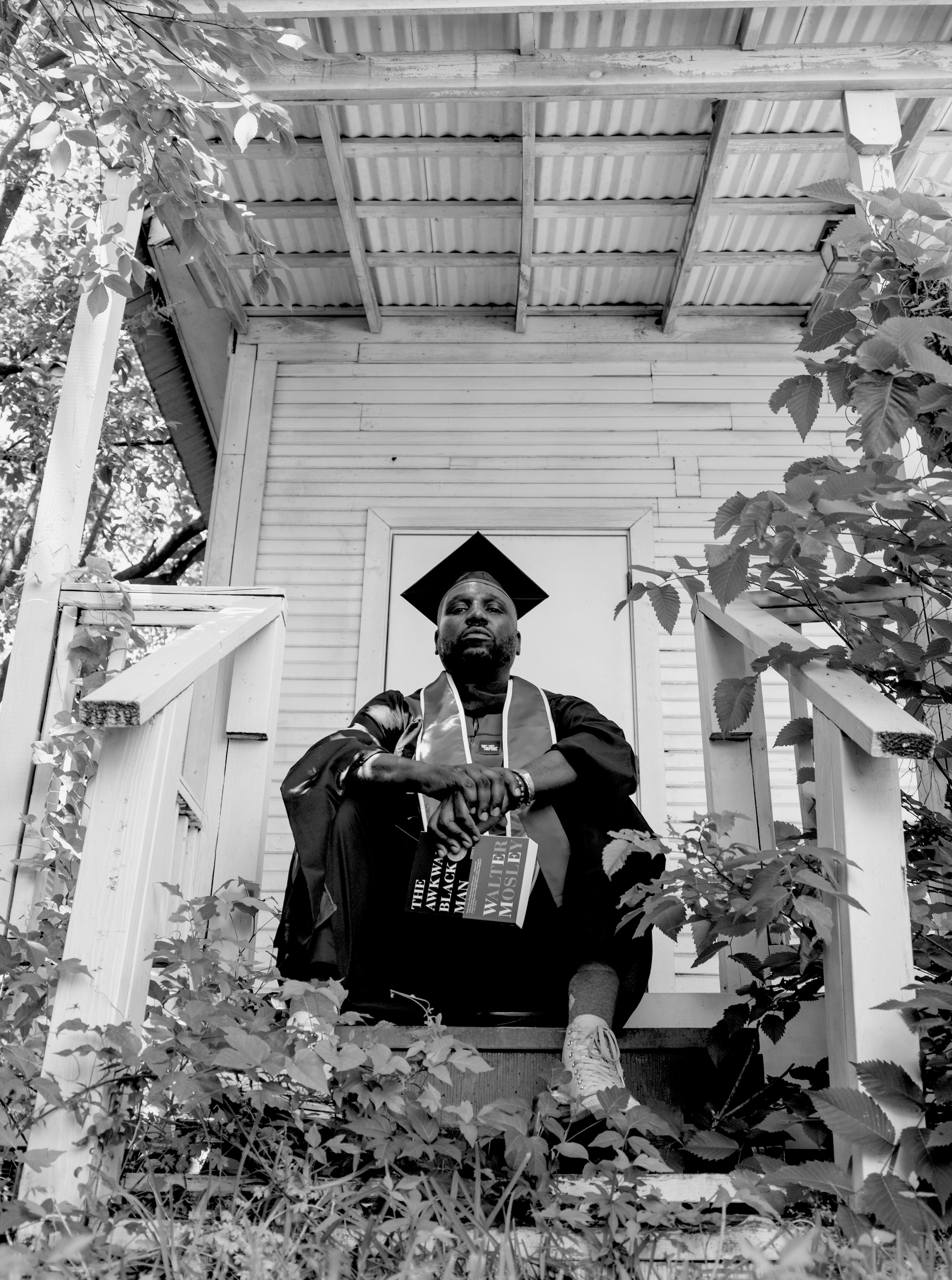 Brian Ellison in his graducation attire at Project Row Houses