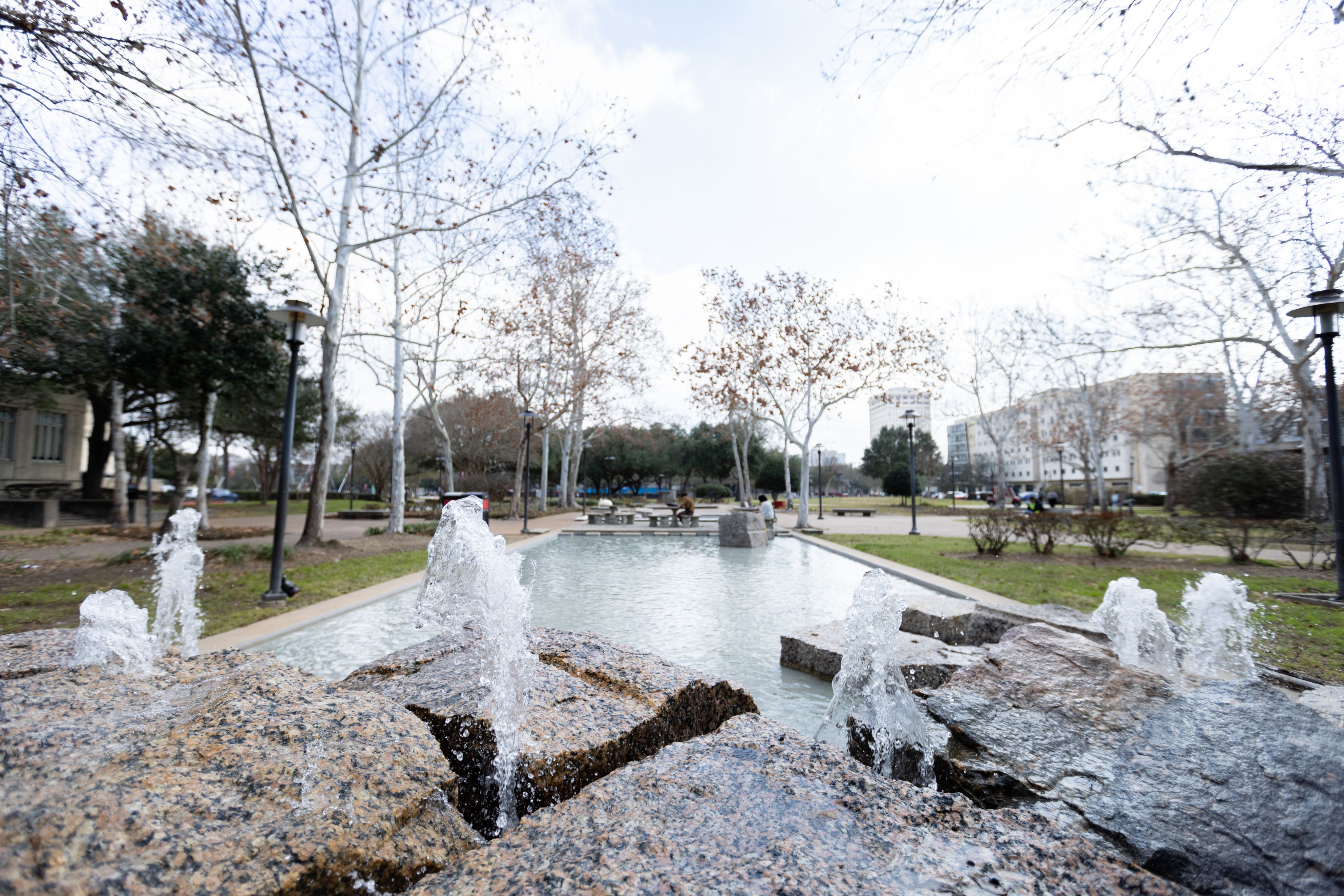 Rectangular reflection pool with fountains located on campus at the University of Houston.
