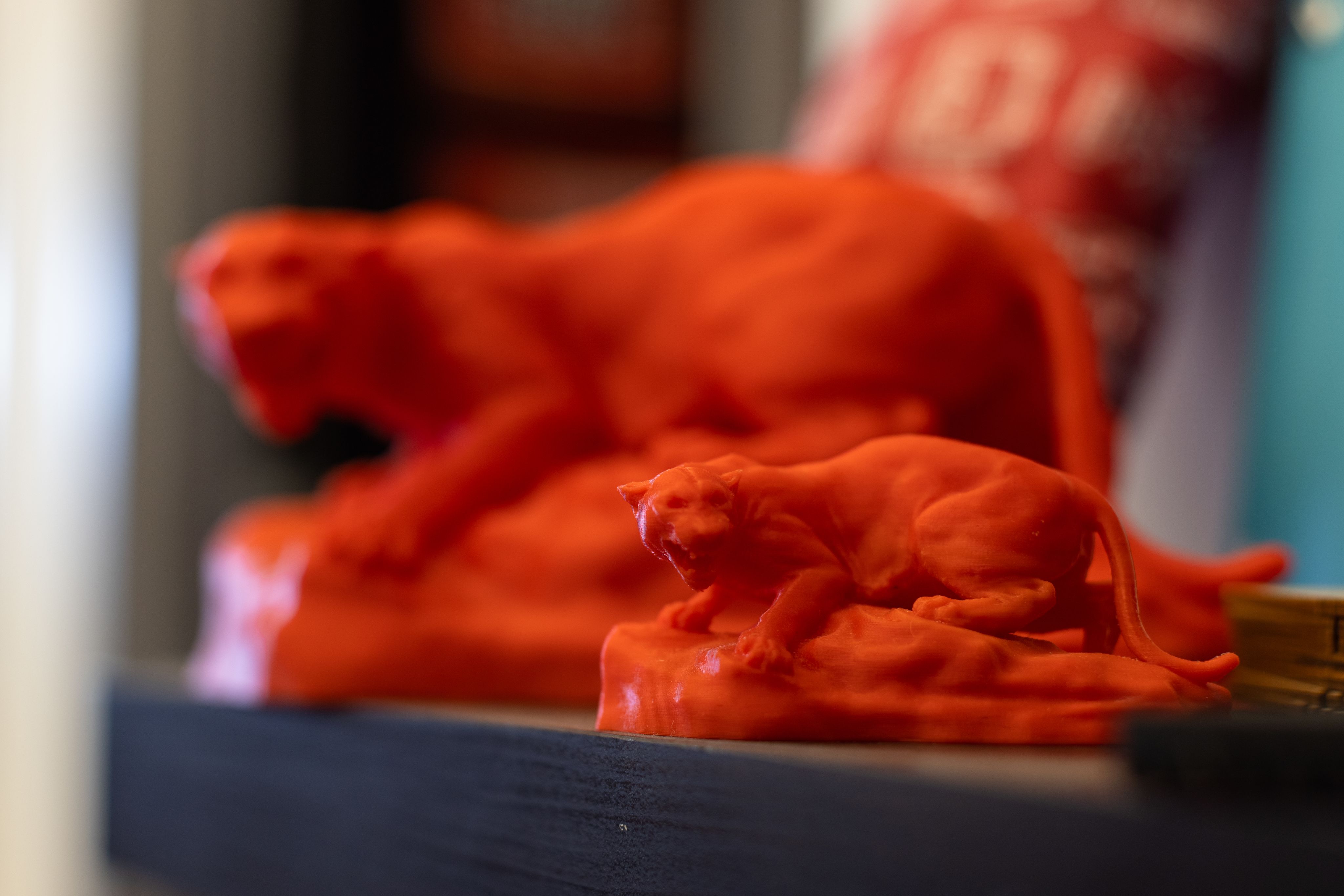 Photo of UH mascot Shasta 3D printed in red.