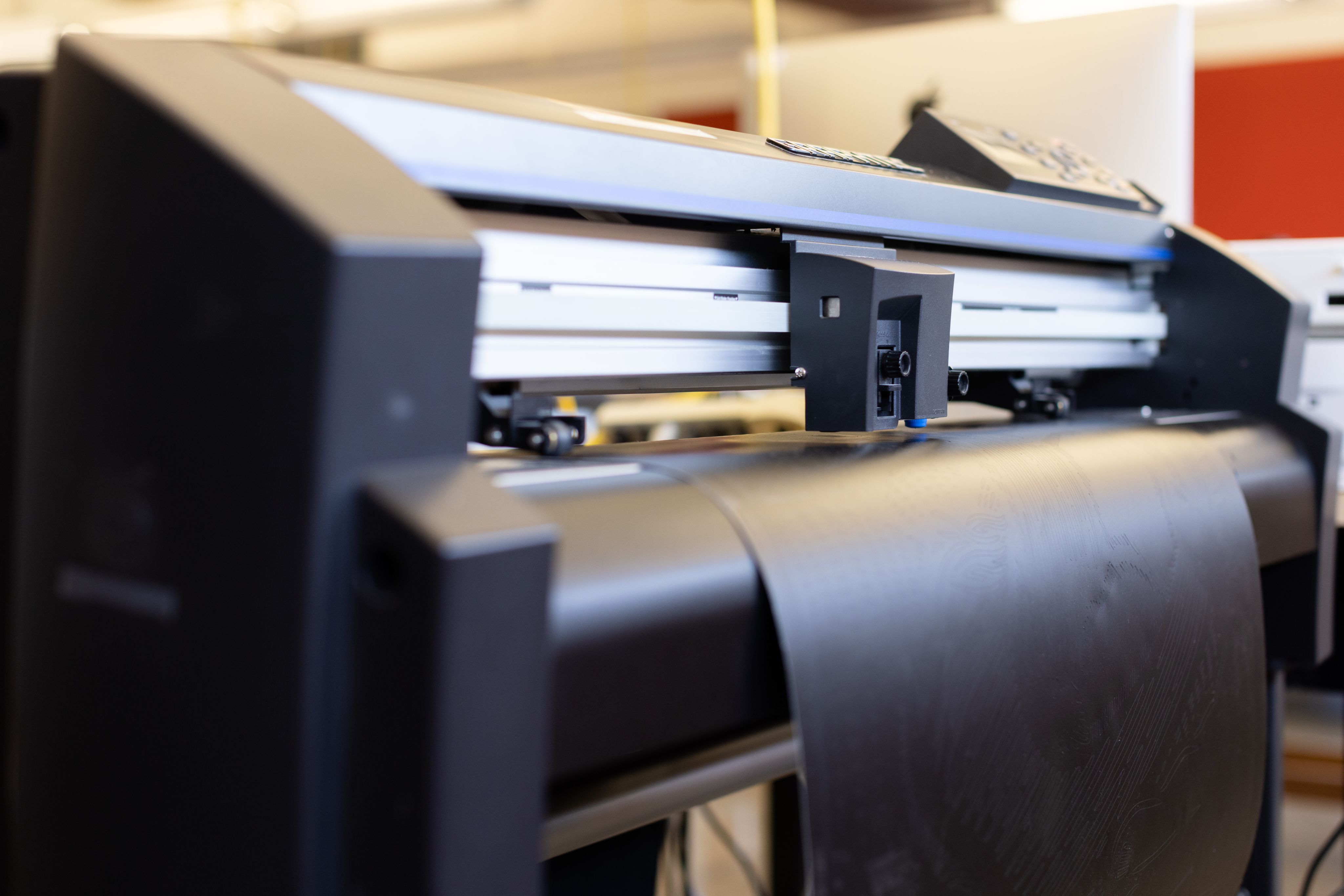 Photo of the vinyl cutter making precise lines on vinyl.