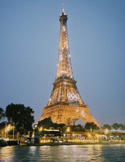 Photo of Eiffel Tower at night during the 2024 Olympics.