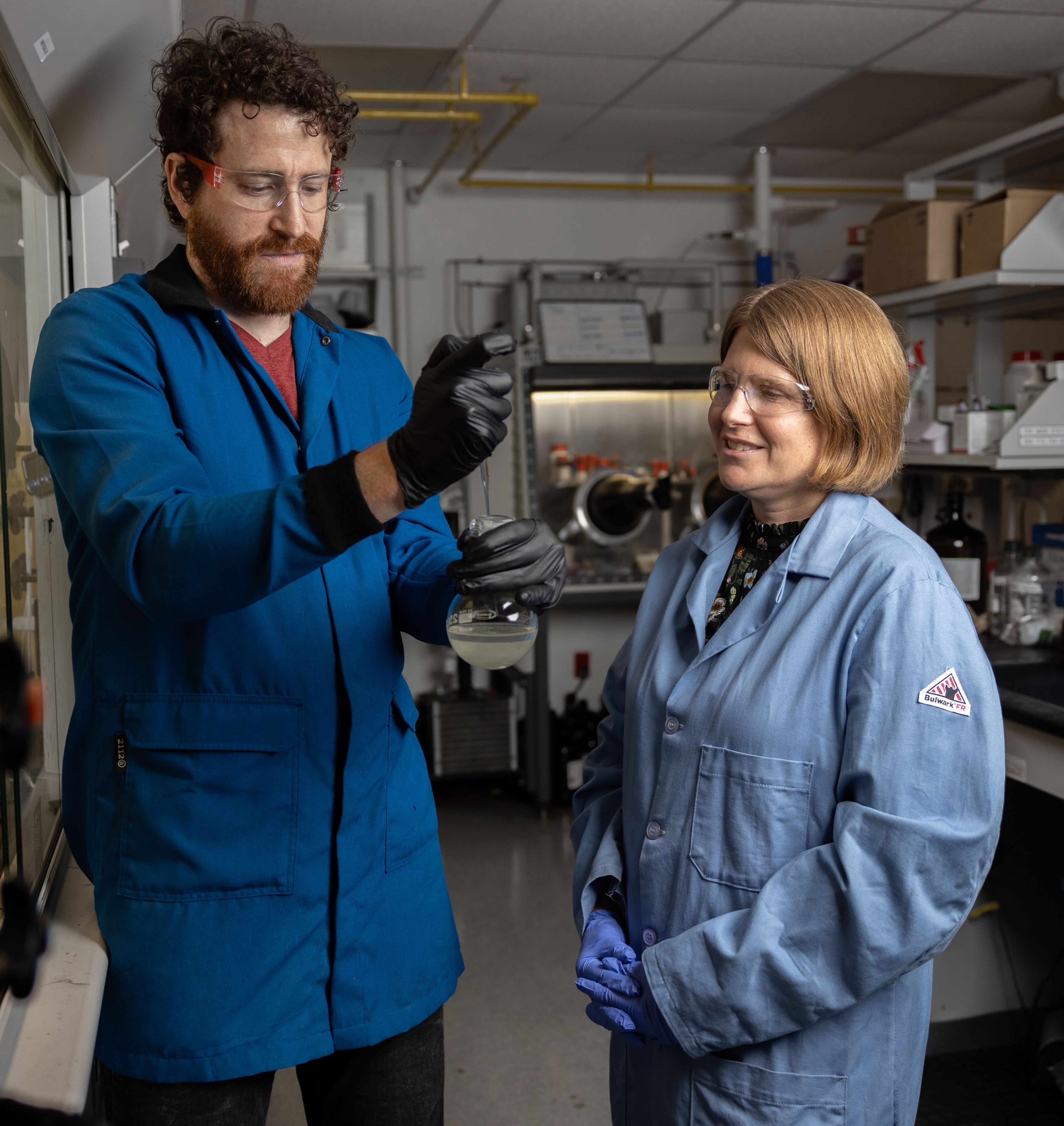 Professor Megan Robertson in the lab with Justin Smith