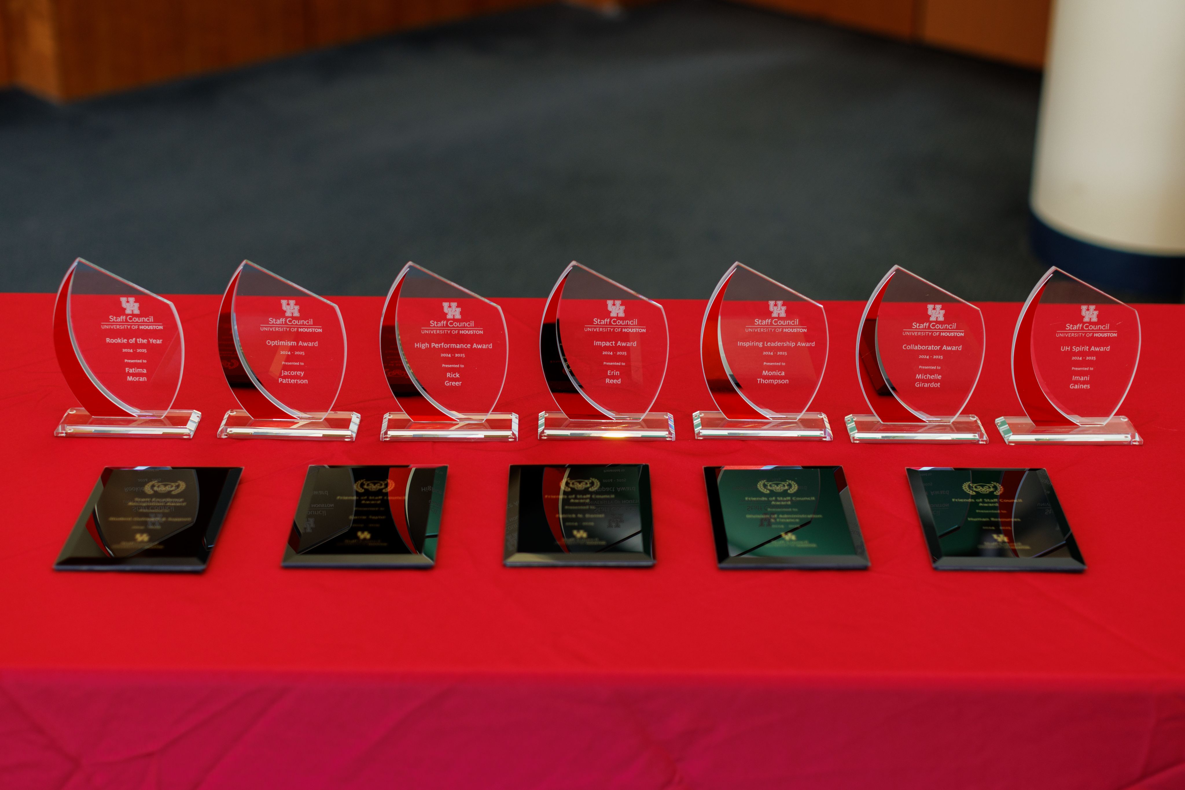 Staff Council awards displayed on a table.