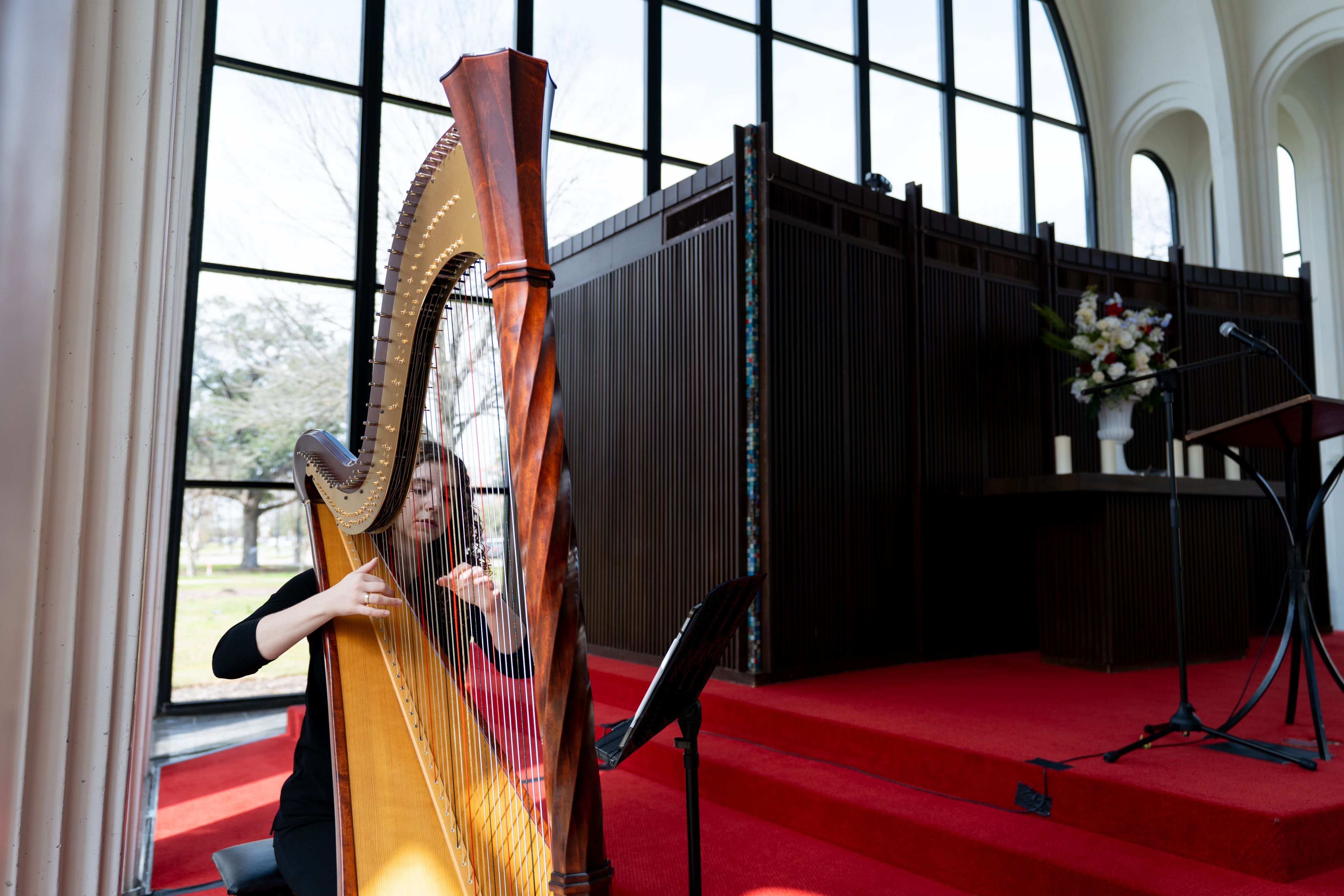 Harpist playing in the A.D. Bruce Religion Center during UH Day of Remembrance 2025.