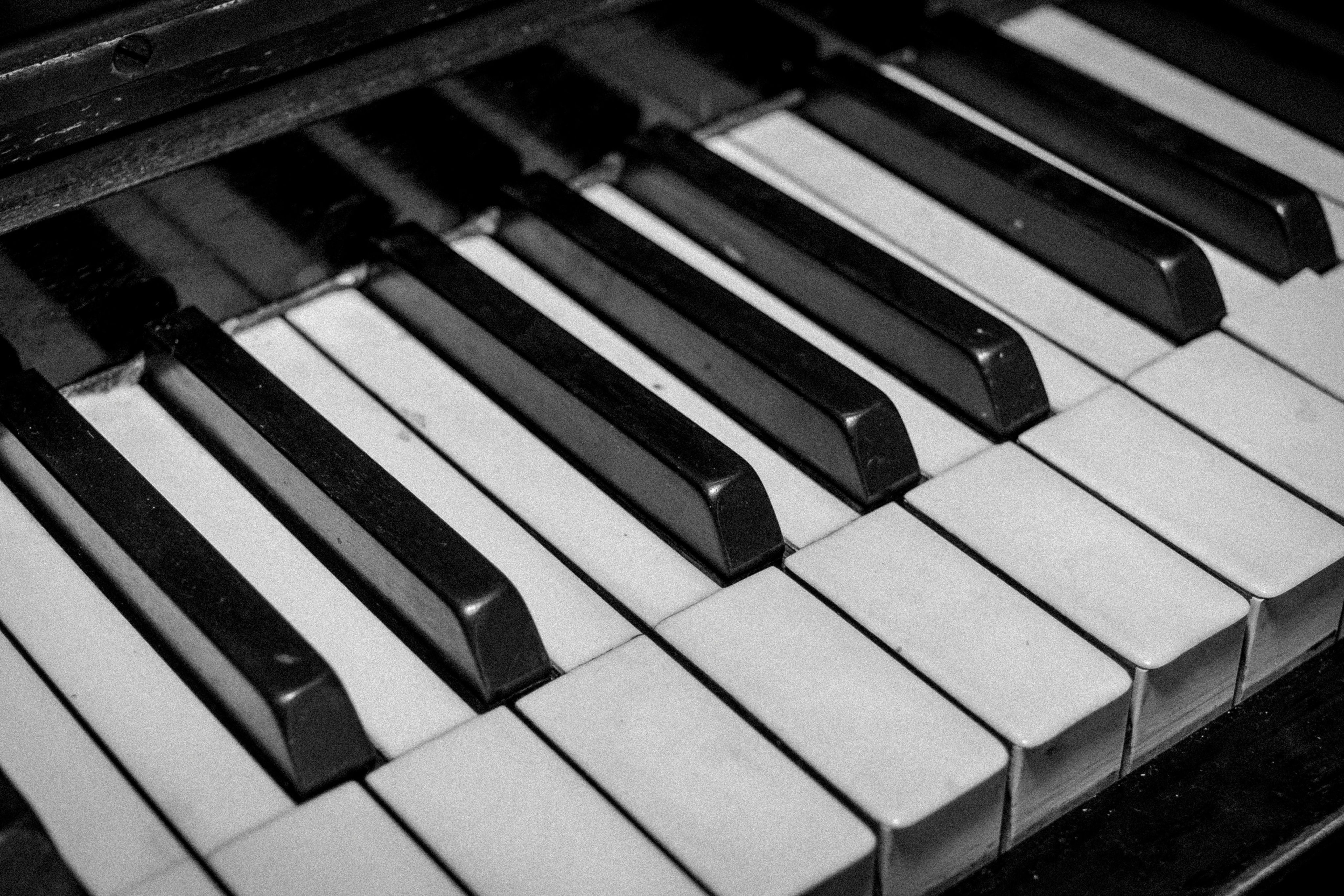 close up of white and black piano keys