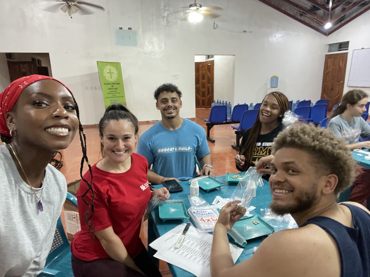 students filling prescription bottles with pills in honduras