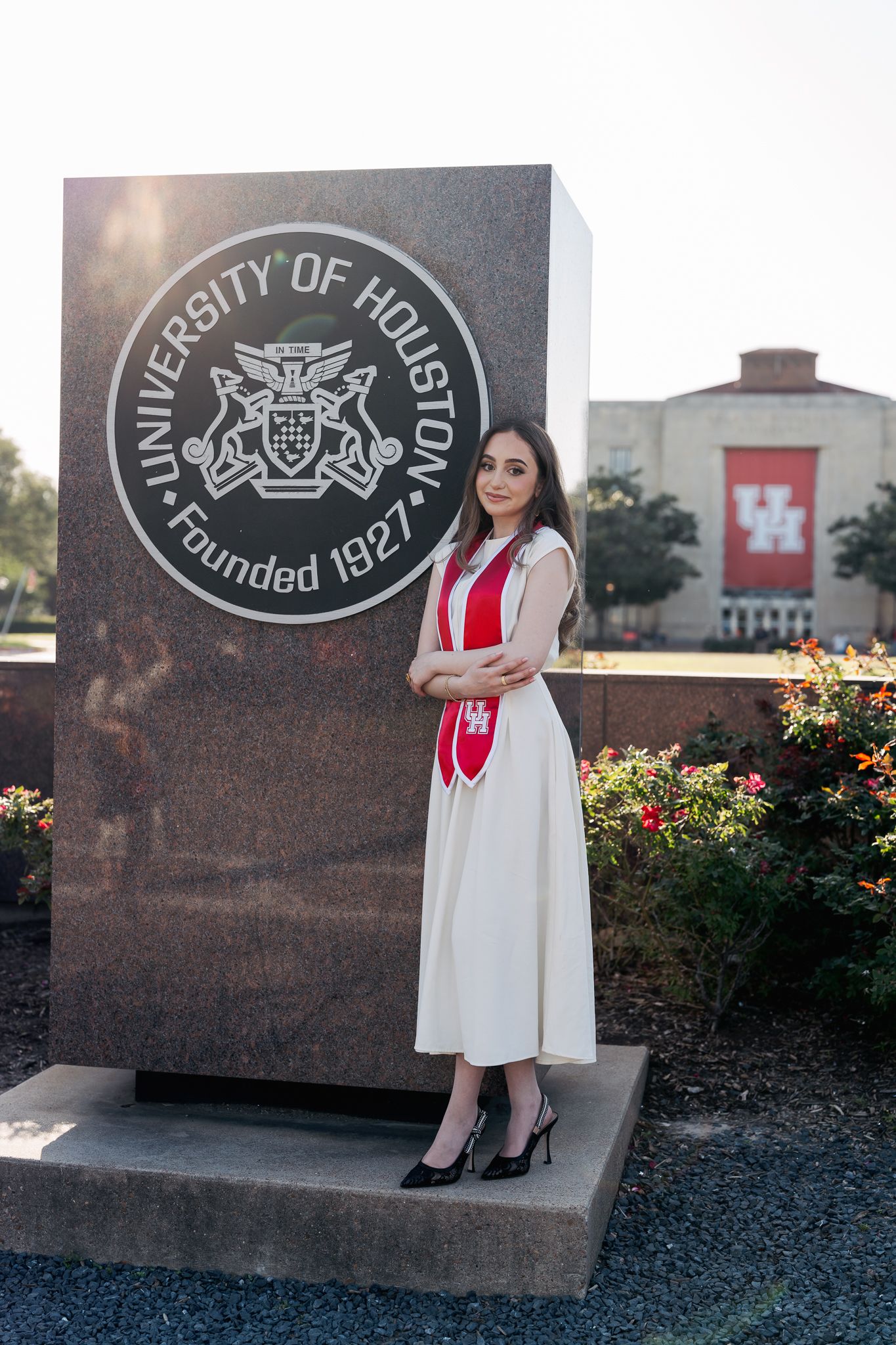 Sana Aljandali in front of the great seal at UH