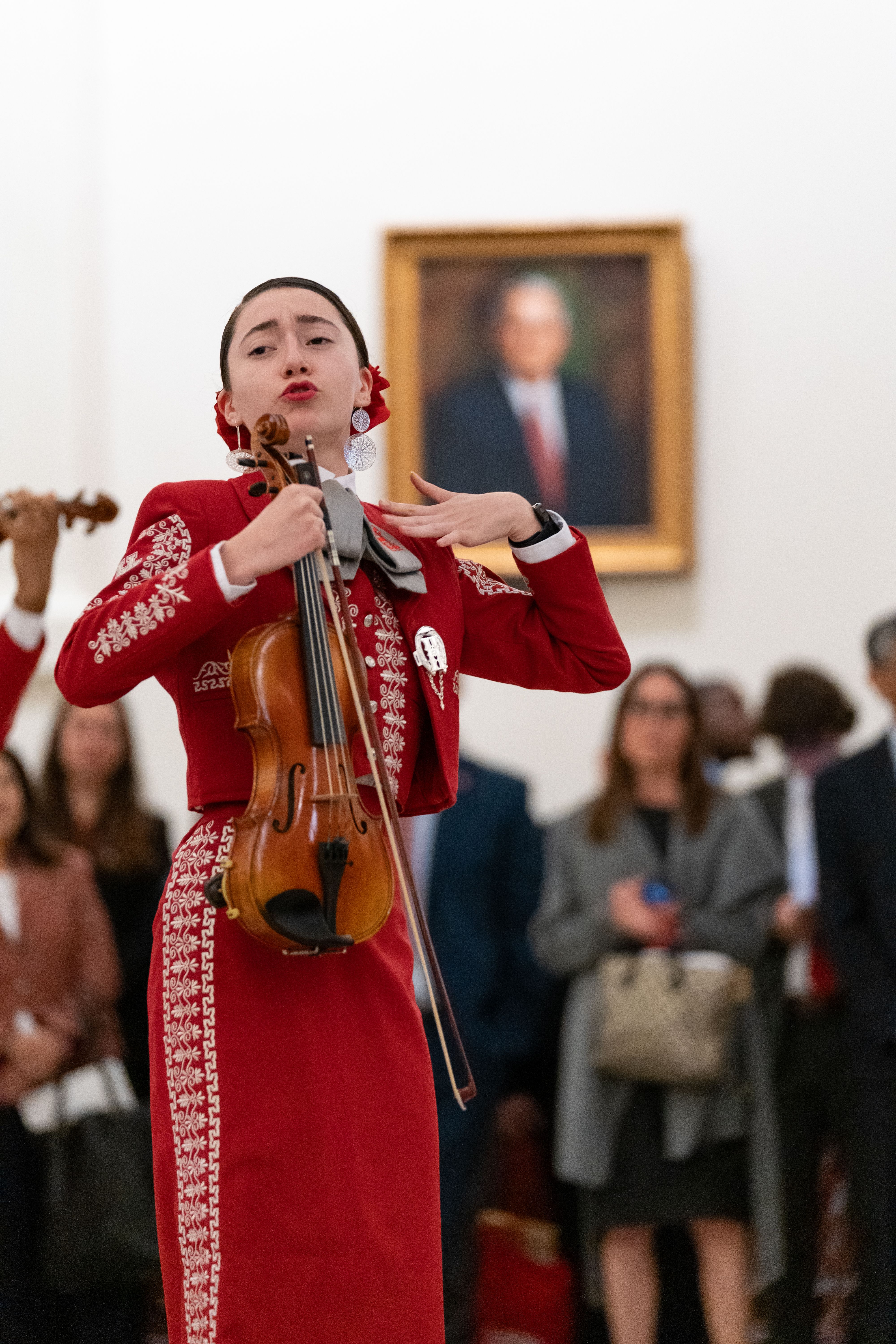 Zoomed in photo of a female mariachi performer.