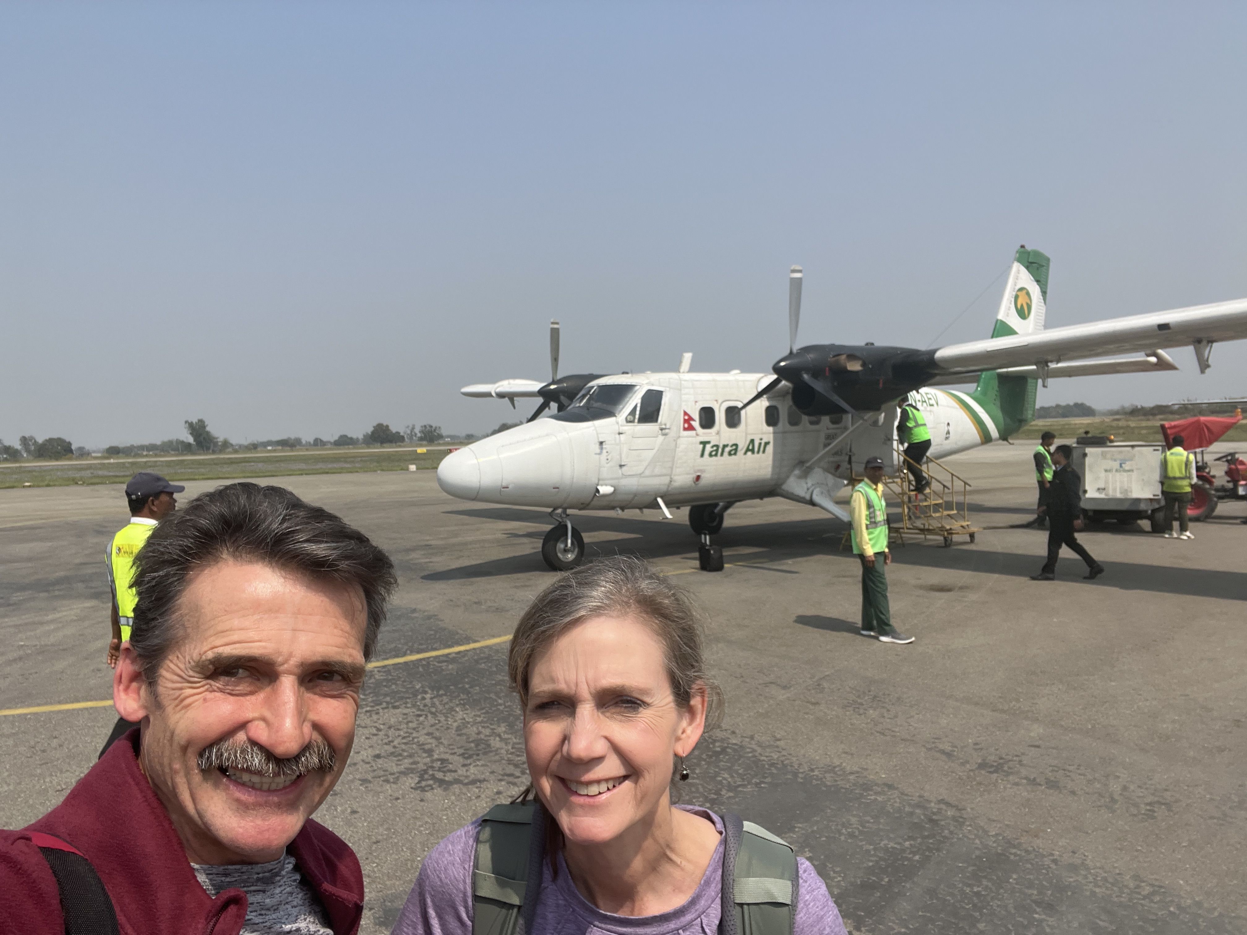 Ackermans with airplane after arriving in Jumla, Nepal.