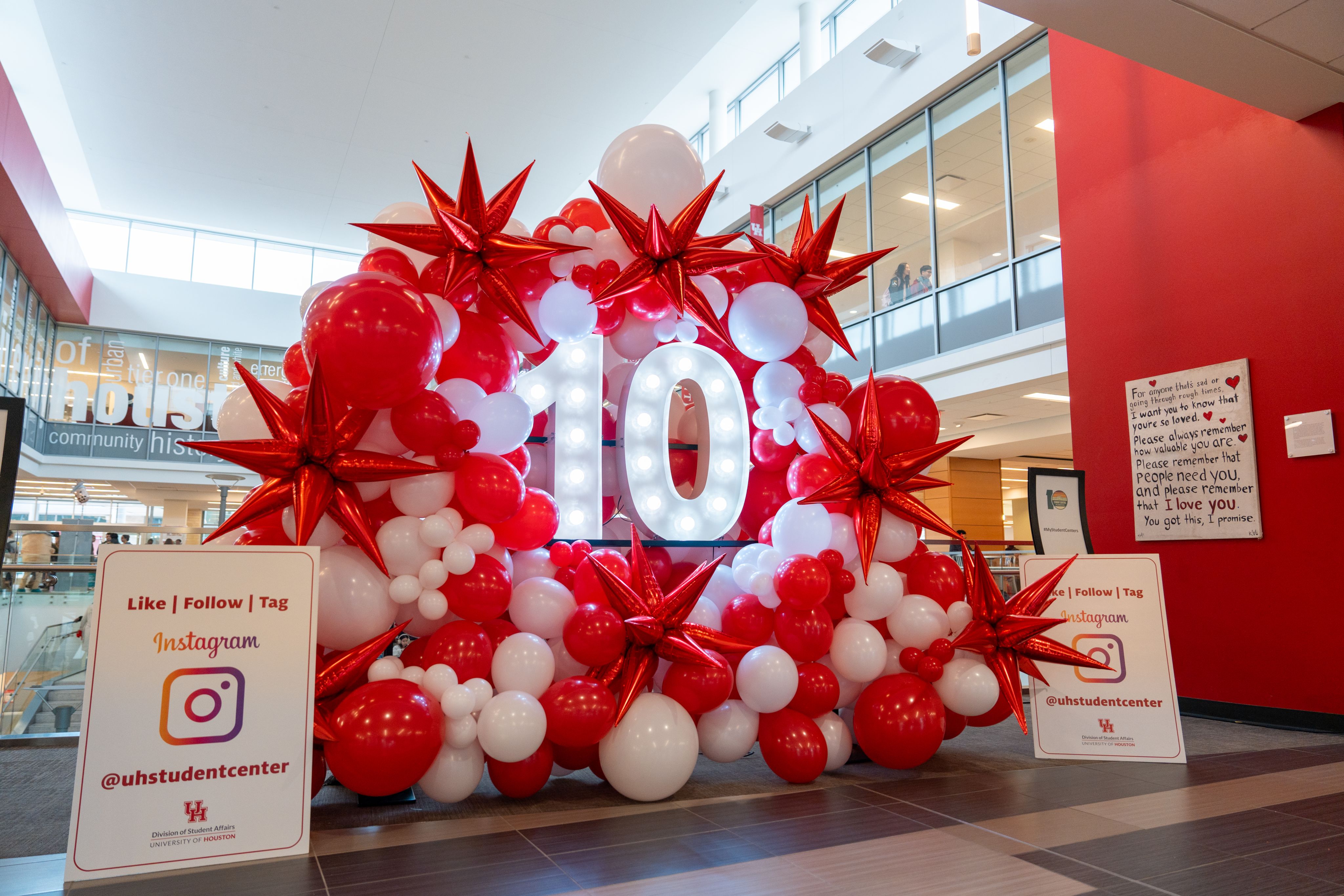 Student Center red and white ballon decoration with an illuminated "10" in the center