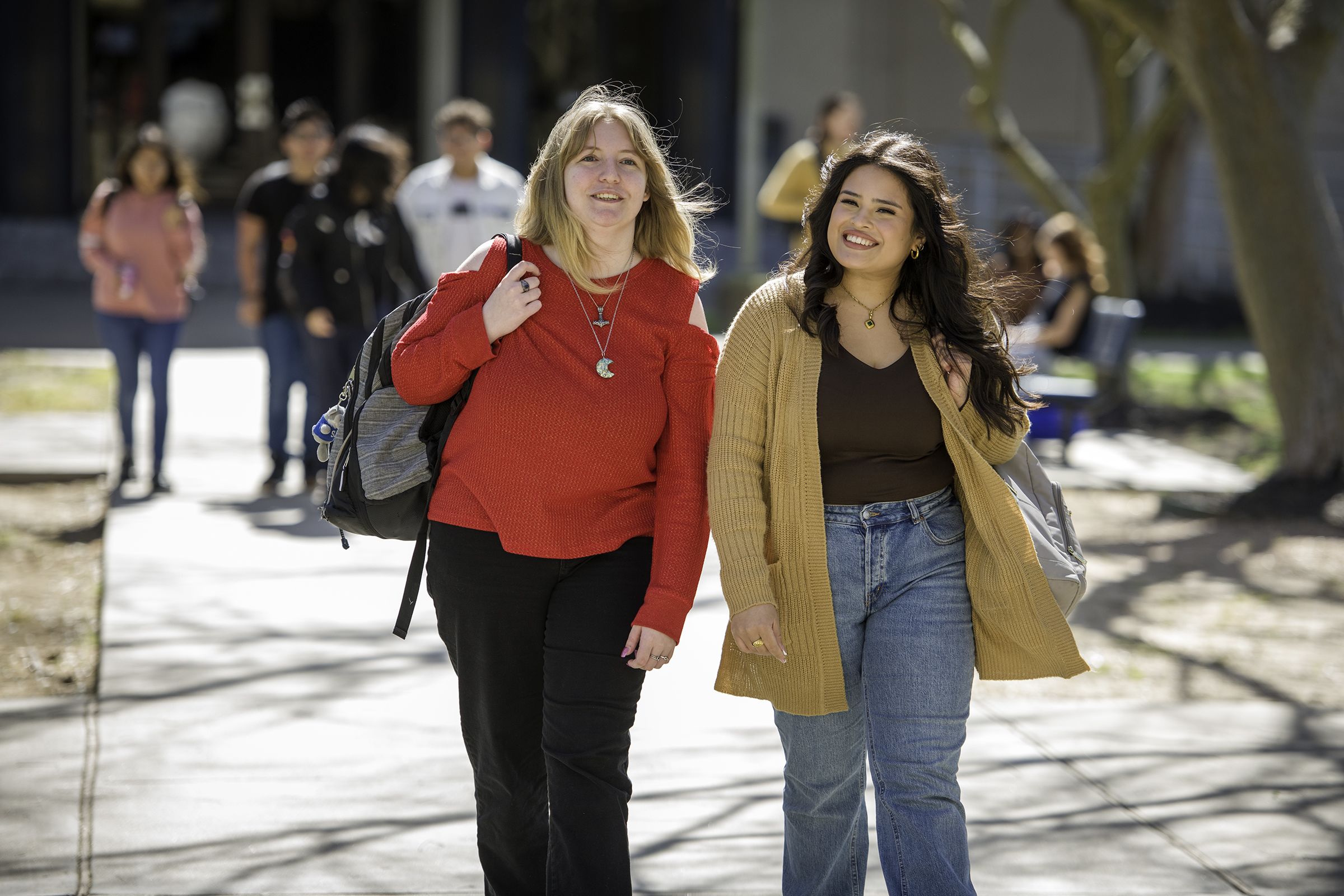 Two females walking on college campus