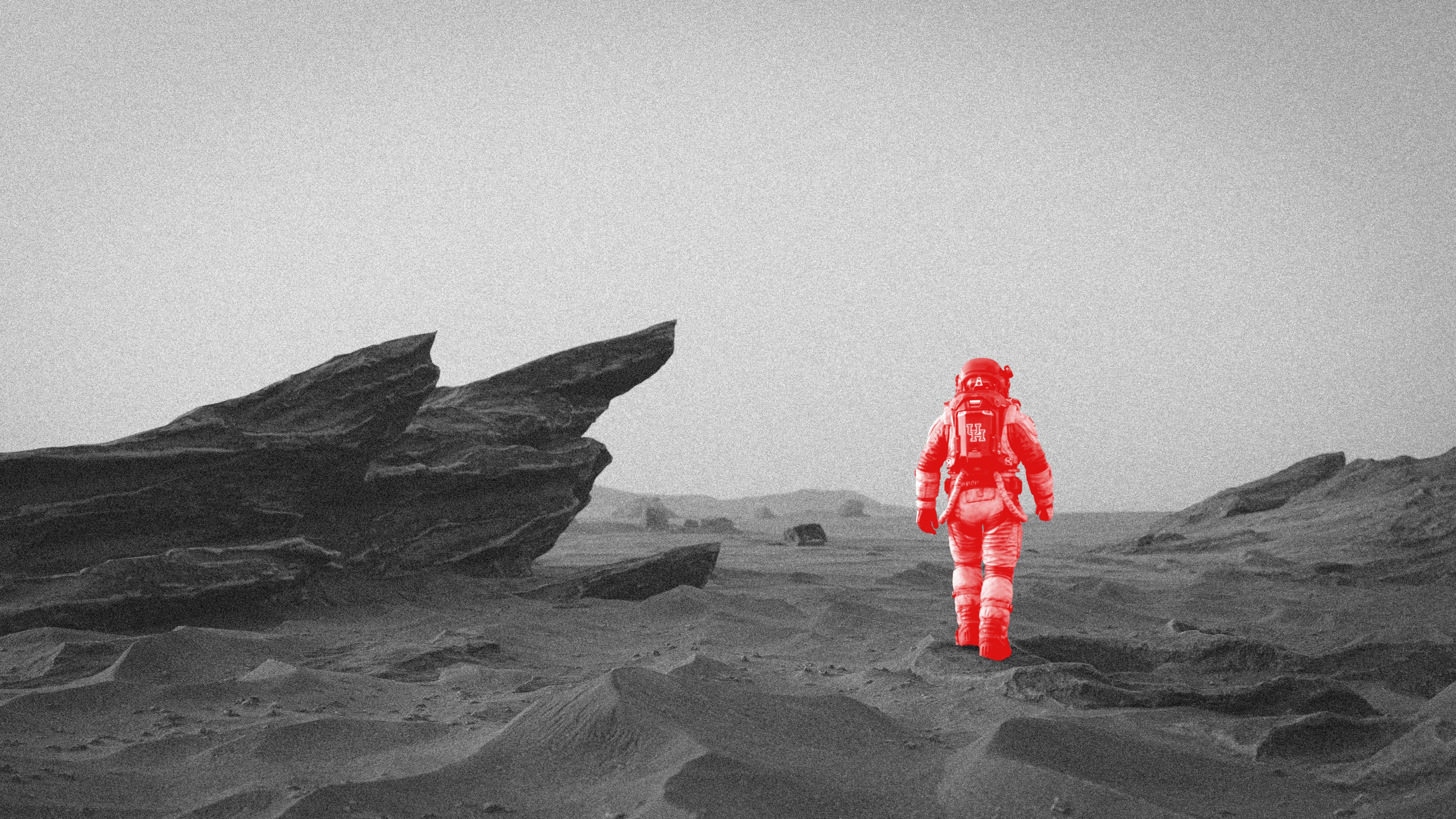 An astronaut in a spacesuit walking on the moon