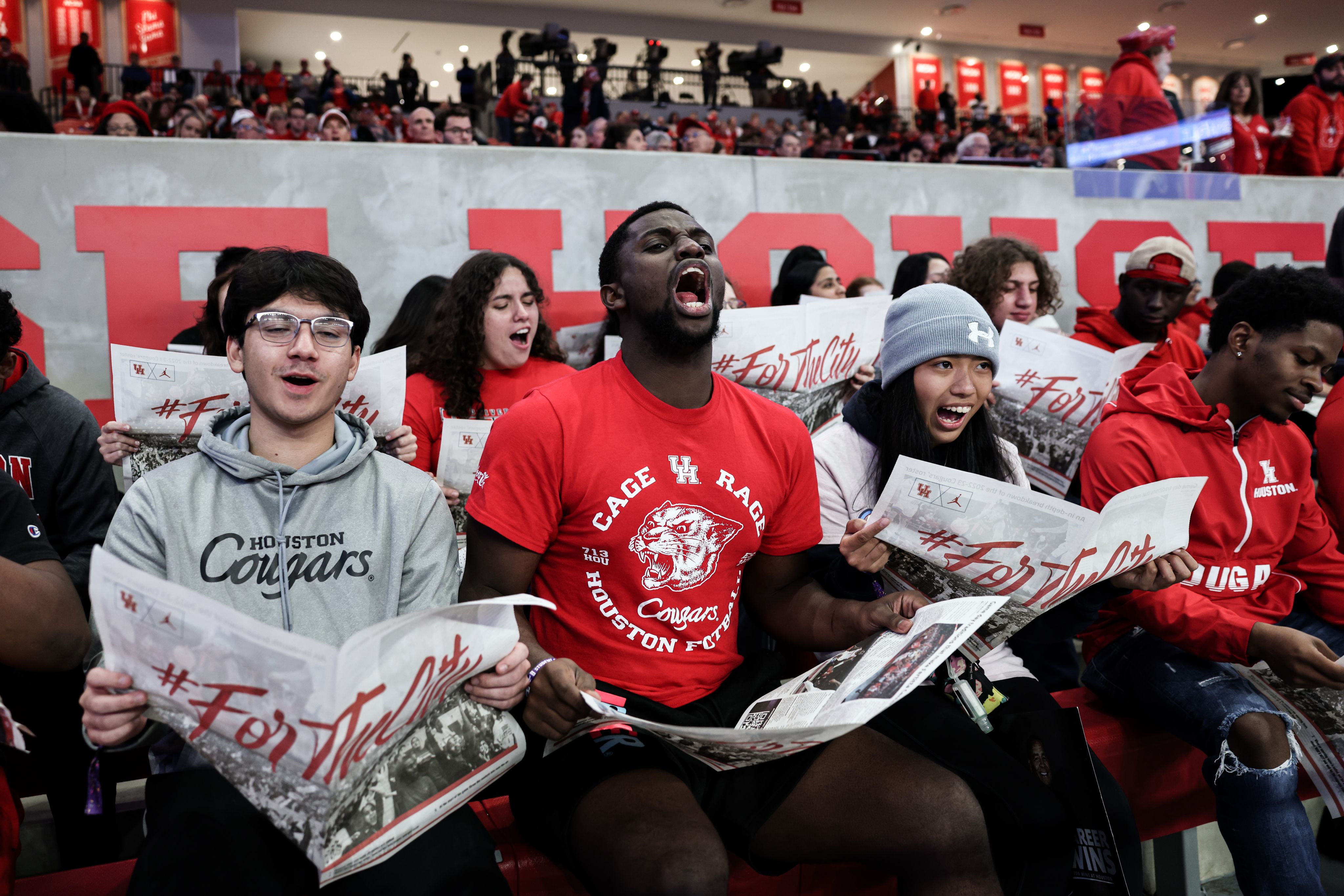 UH fans cheering during a sports game.