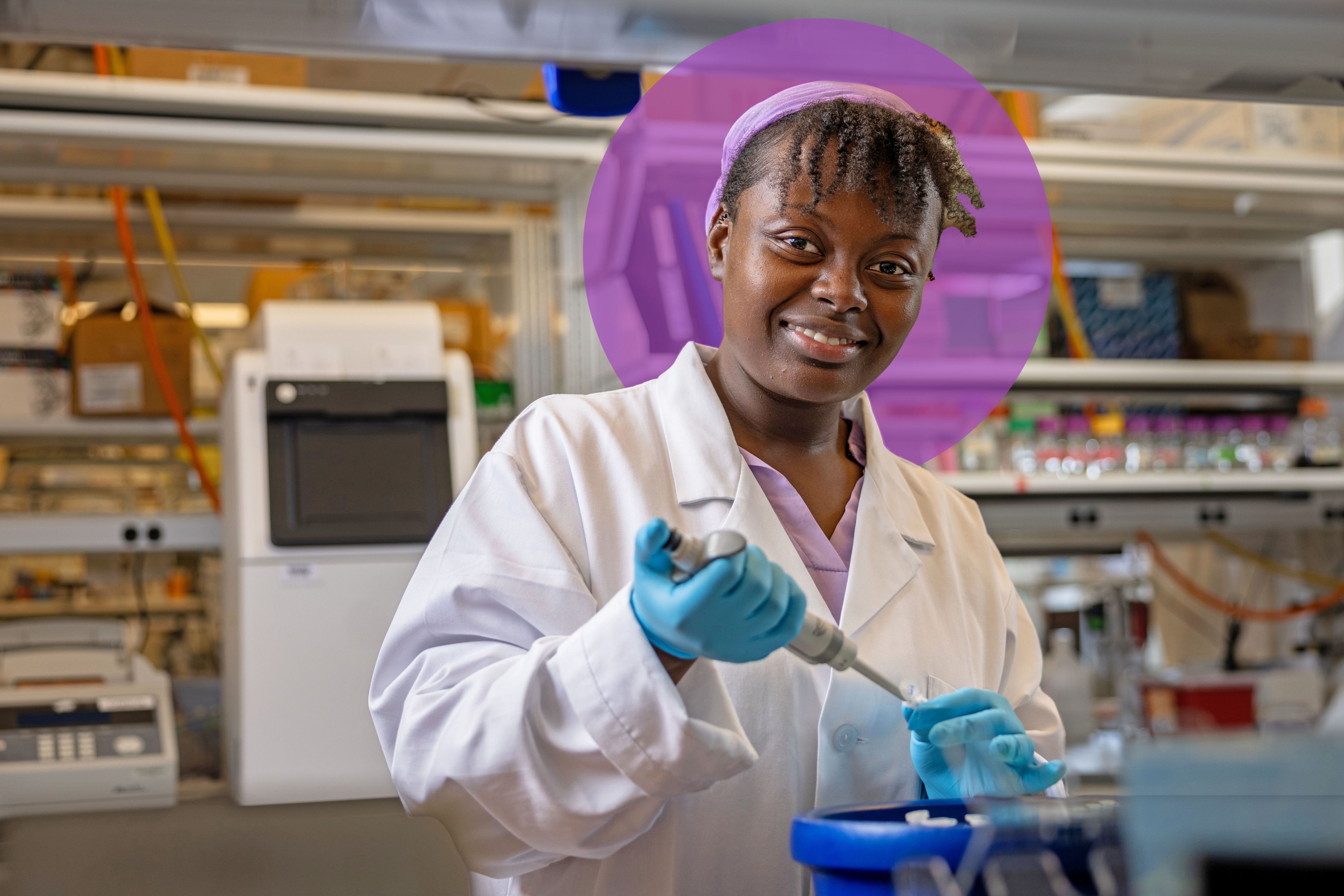 Portrait of Funmi Babajide in a white lab coat.