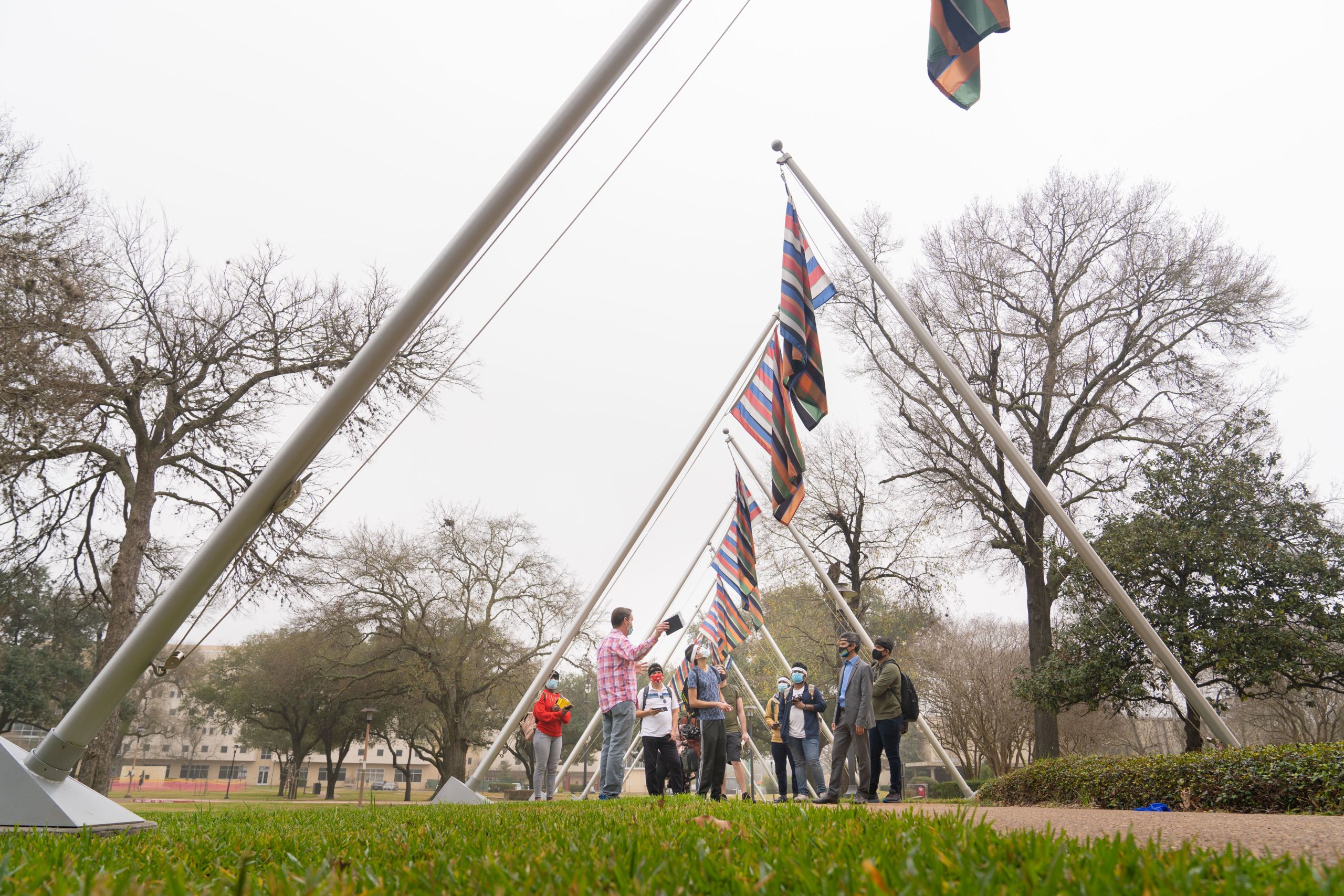 Public Art UHS curator Mike Guidry talks to engineering students during a tour of "Color Field."