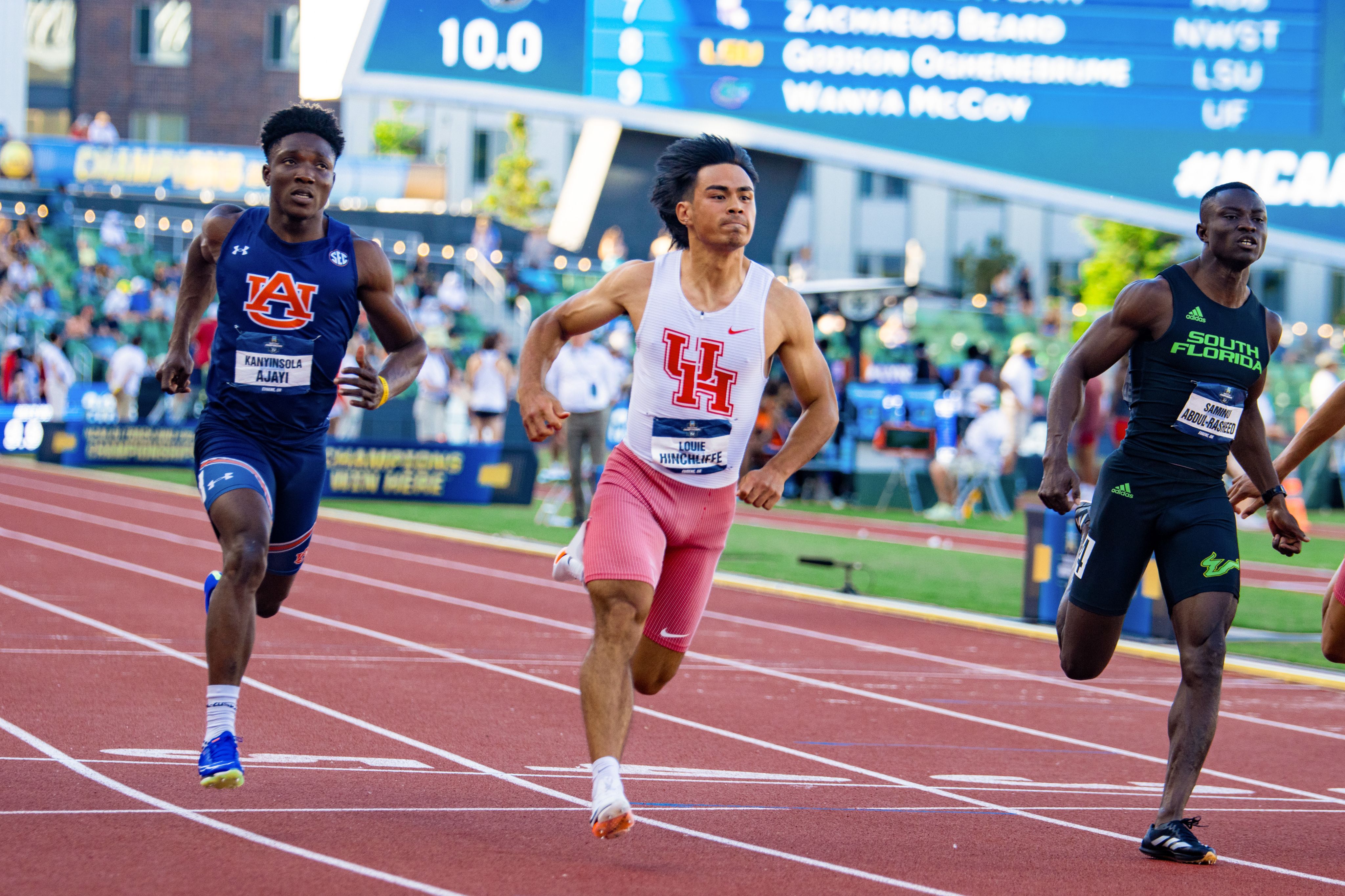 Track athlete Louie Hinchliffe racing in a UH uniform.