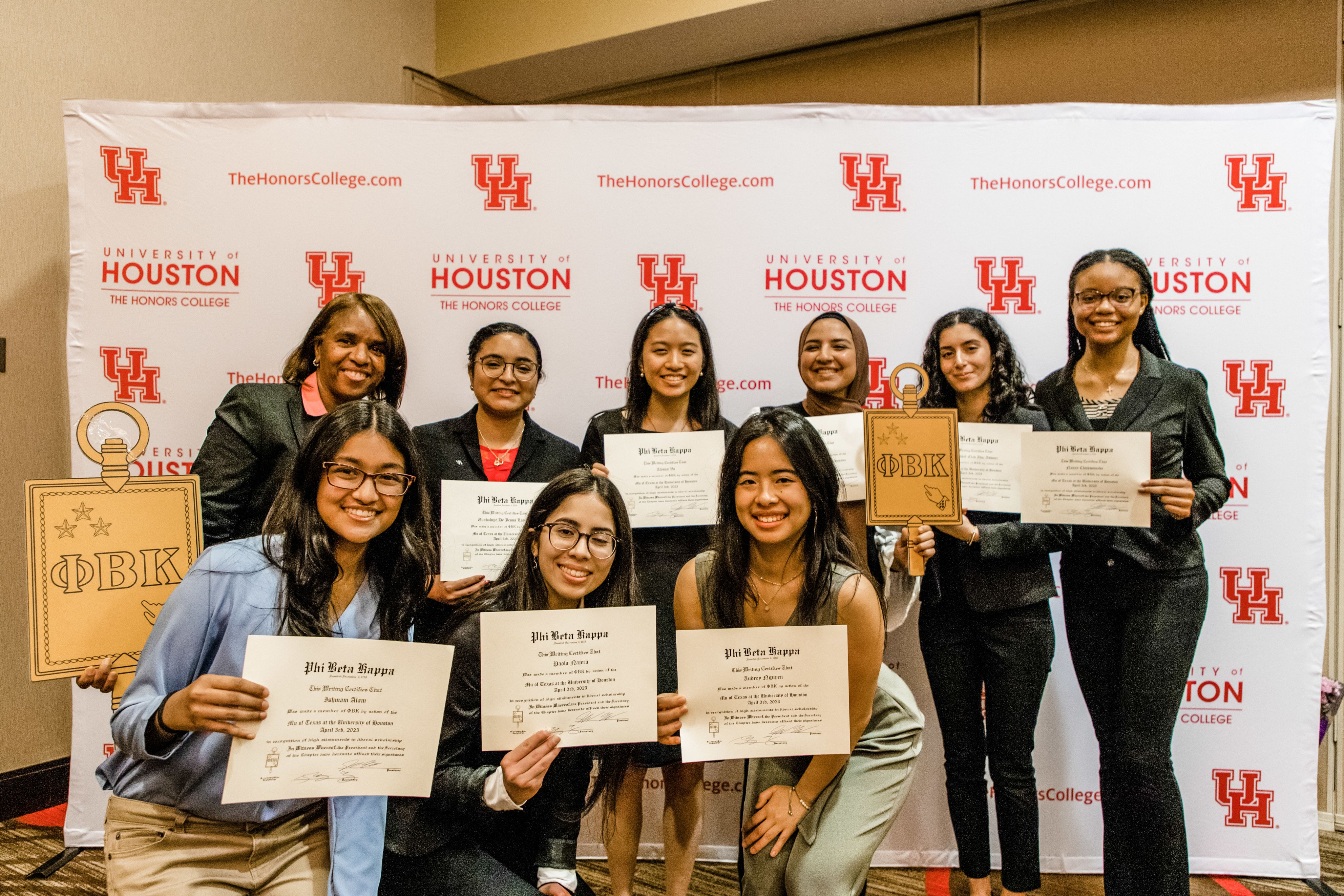 Group of students posing with certificates