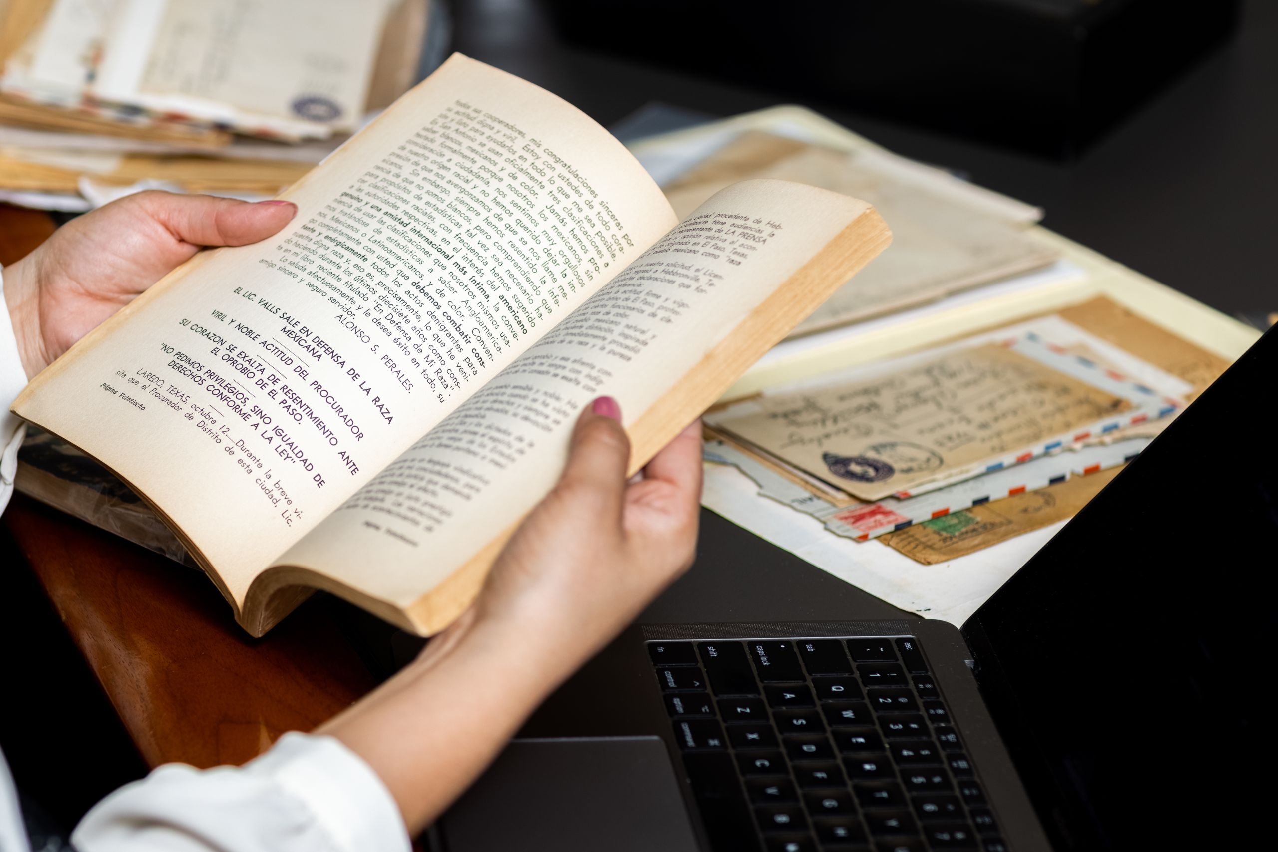 Gauthereau hand shown holding a book