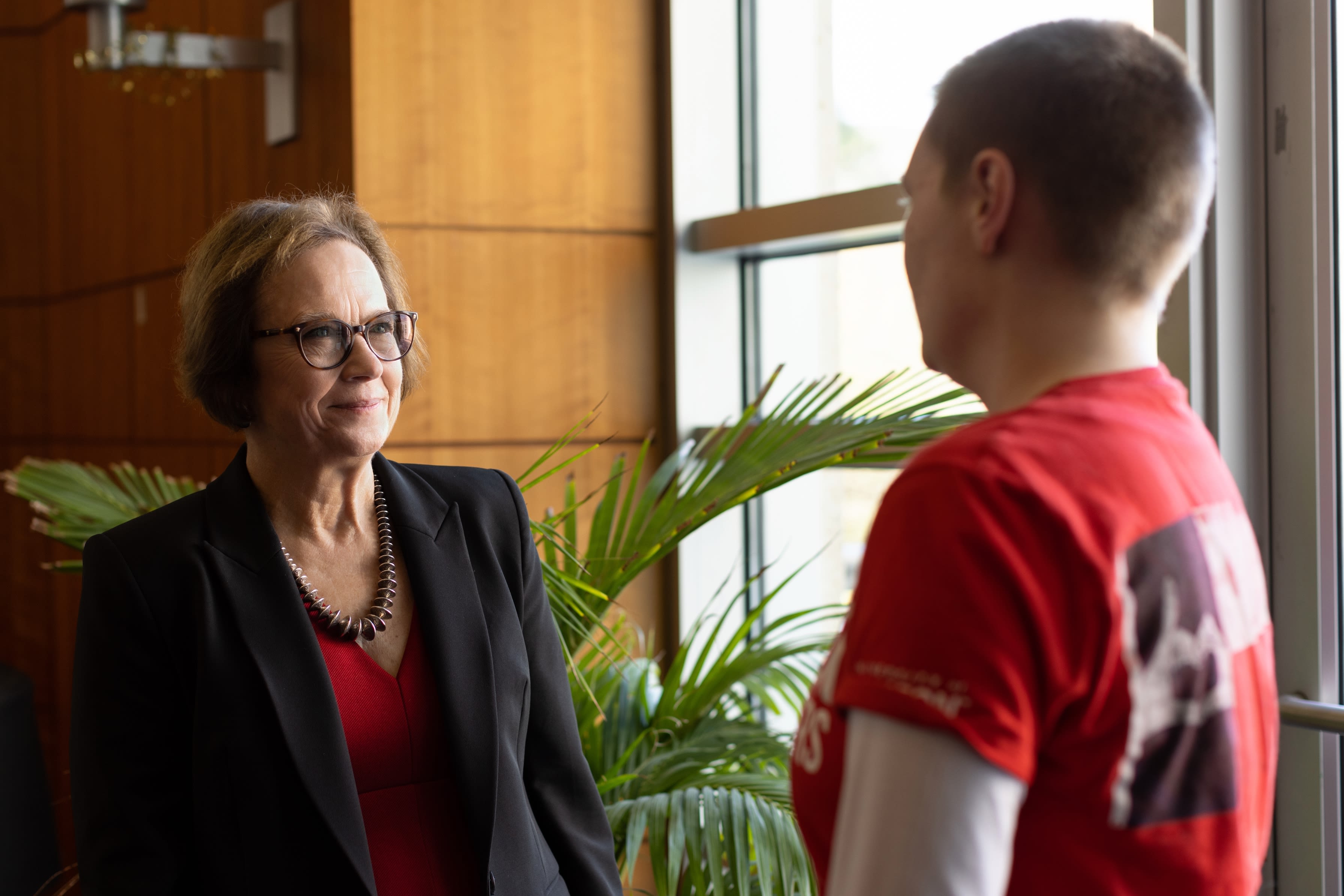 Provost Diane Z. Chase in faculty cafe with group of people