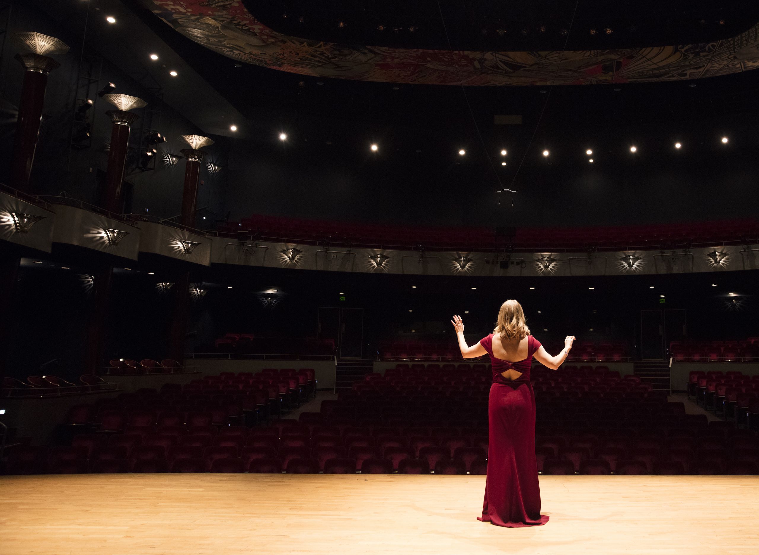 Opera singer in an empty performance hall