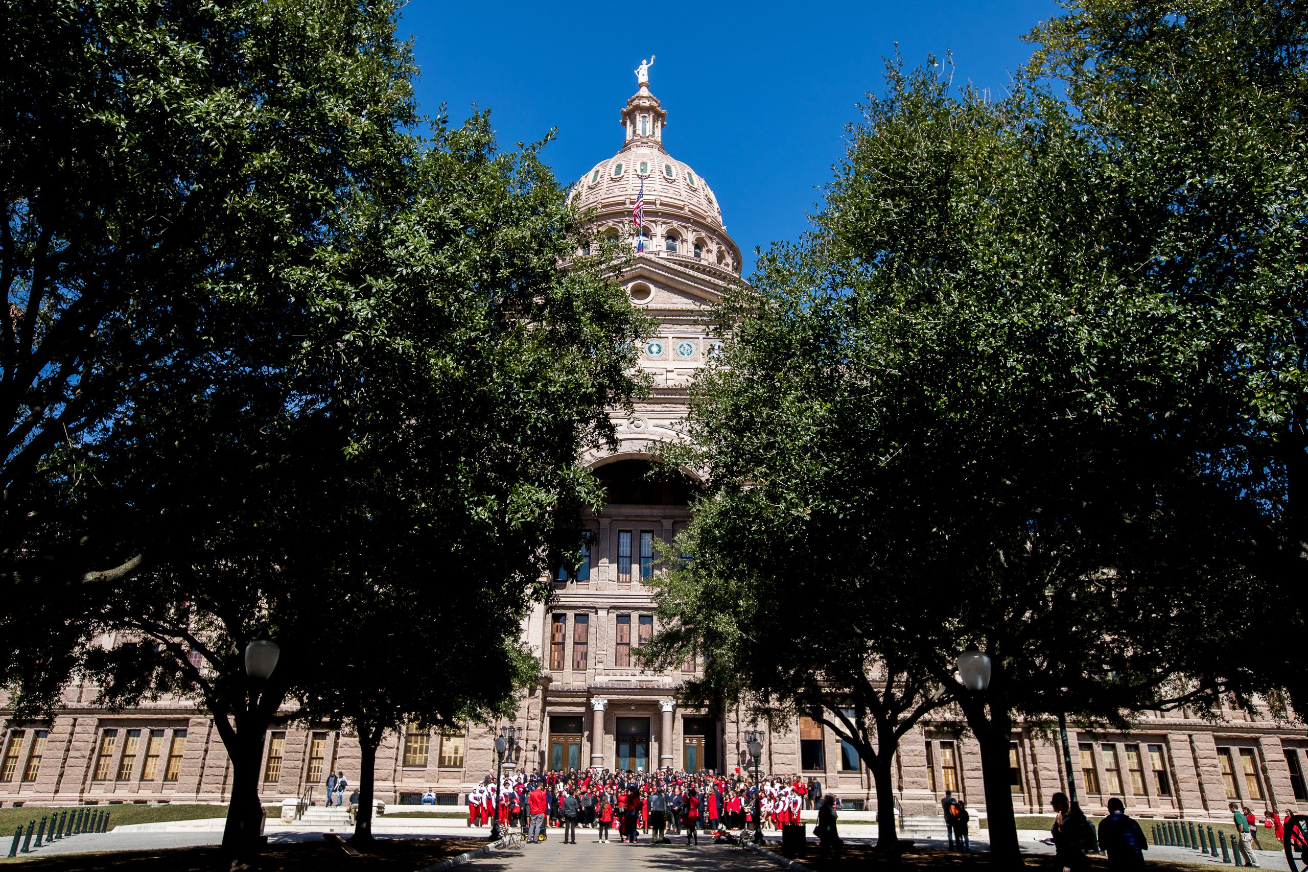 Texas capitol building exterior with group of more than 200 representatives from UH