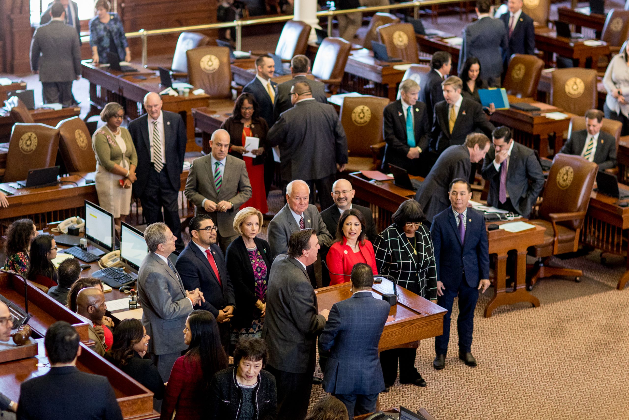 UH alumni serving in the Legislature gather on the floor of the Texas House of Representatives.